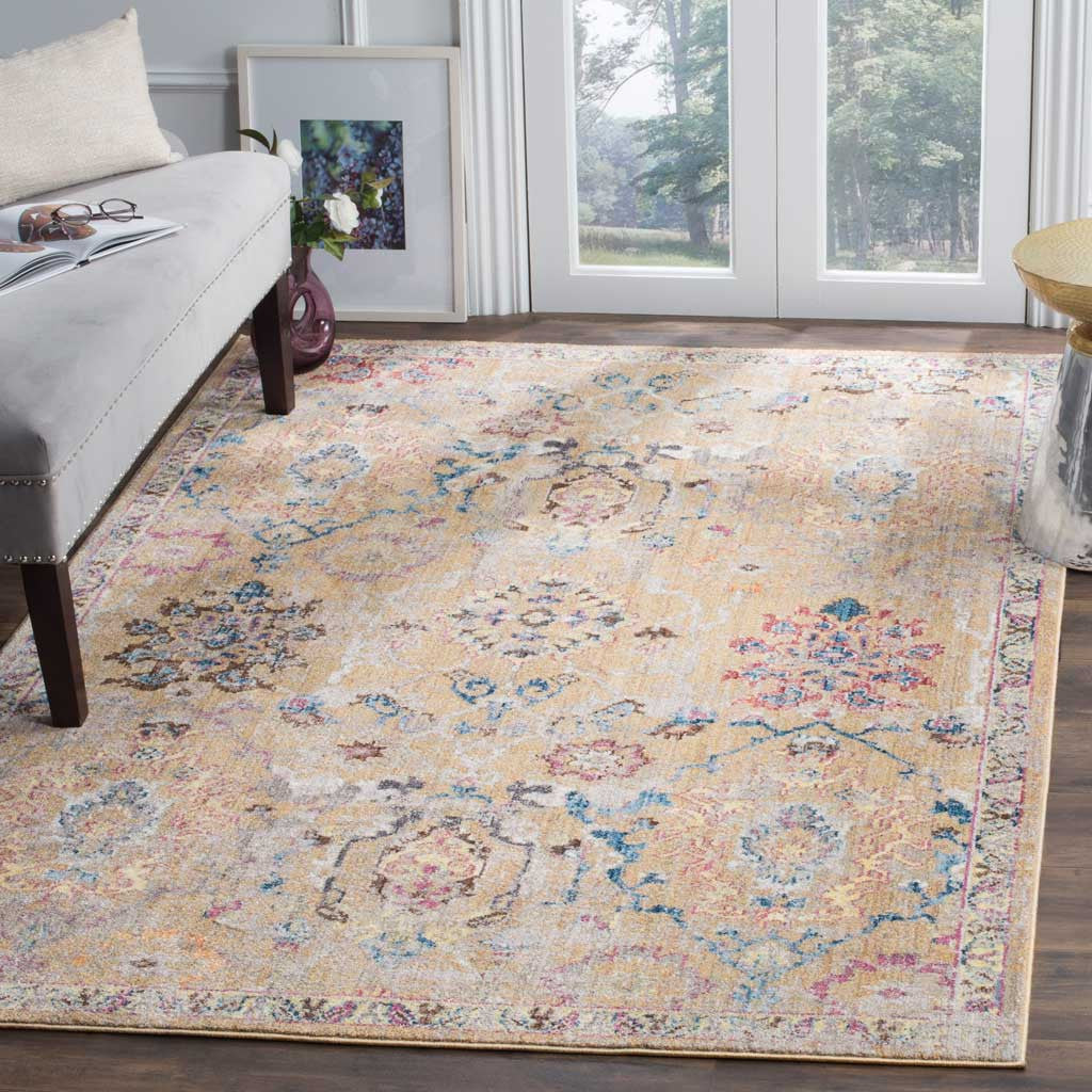 Muted blue and blush florals bring vintage-inspired warmth to a camel area rug