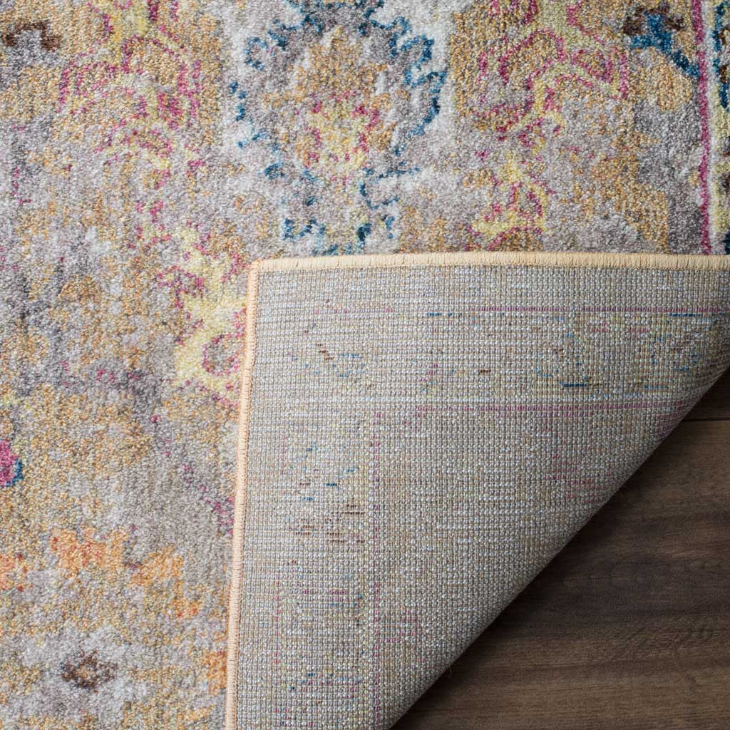 Woven backing supports the rug's colorful, softly distressed floral pile