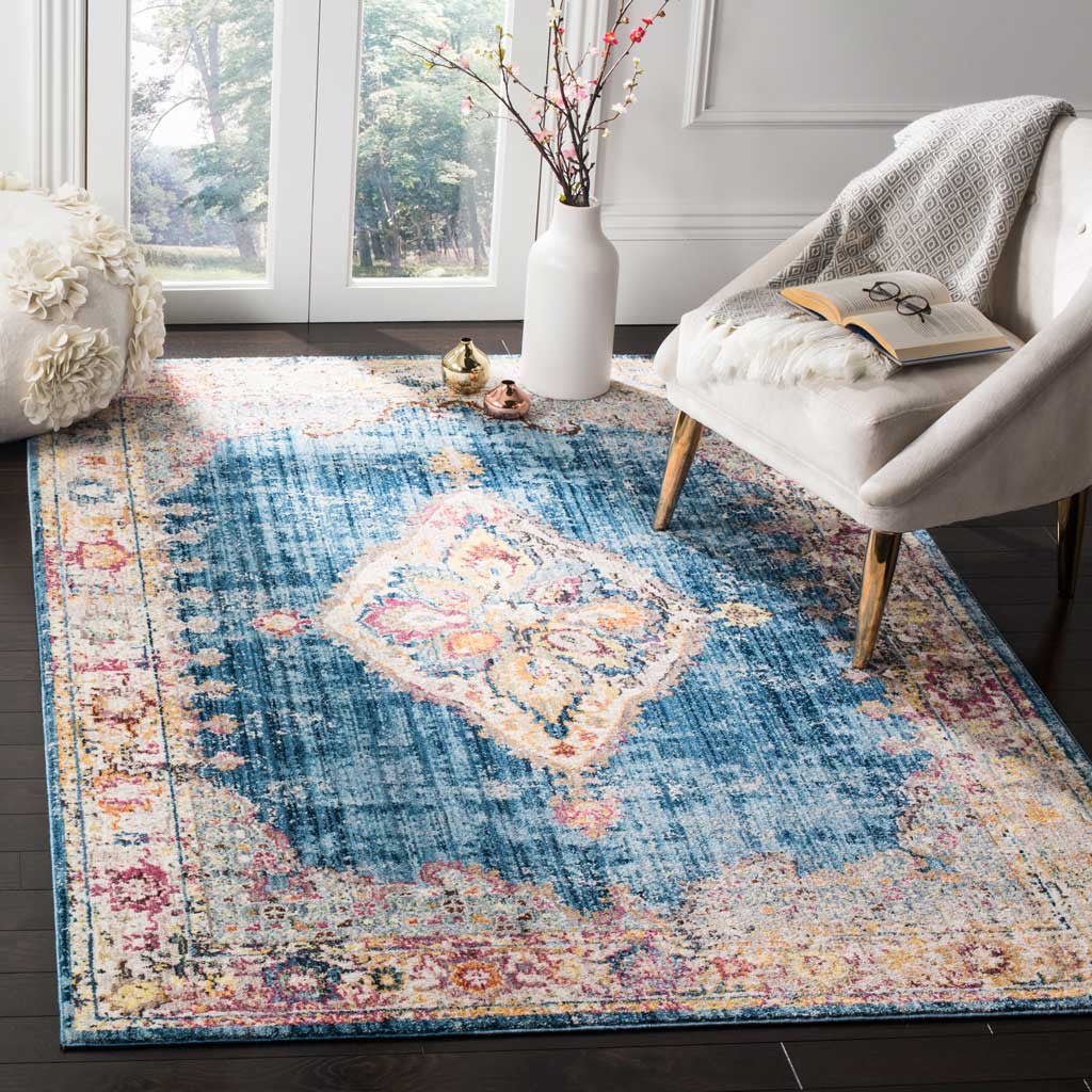 A blue-and-ivory medallion rug adds colorful traditional character beneath an accent chair