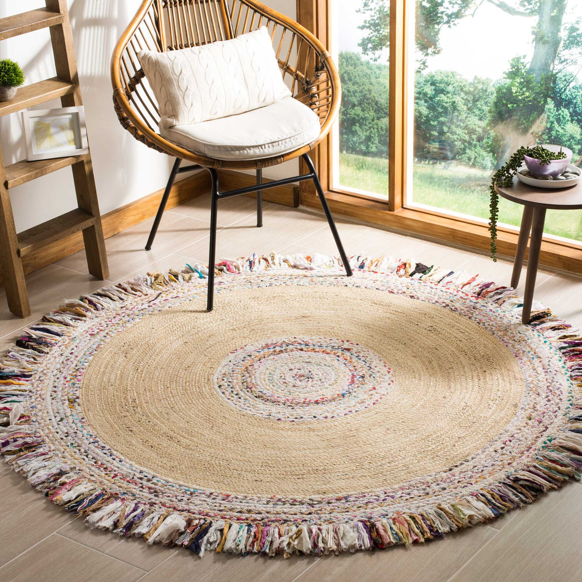 Neutral jute and a confetti-colored fringe give this round rug a relaxed, cheerful feel.