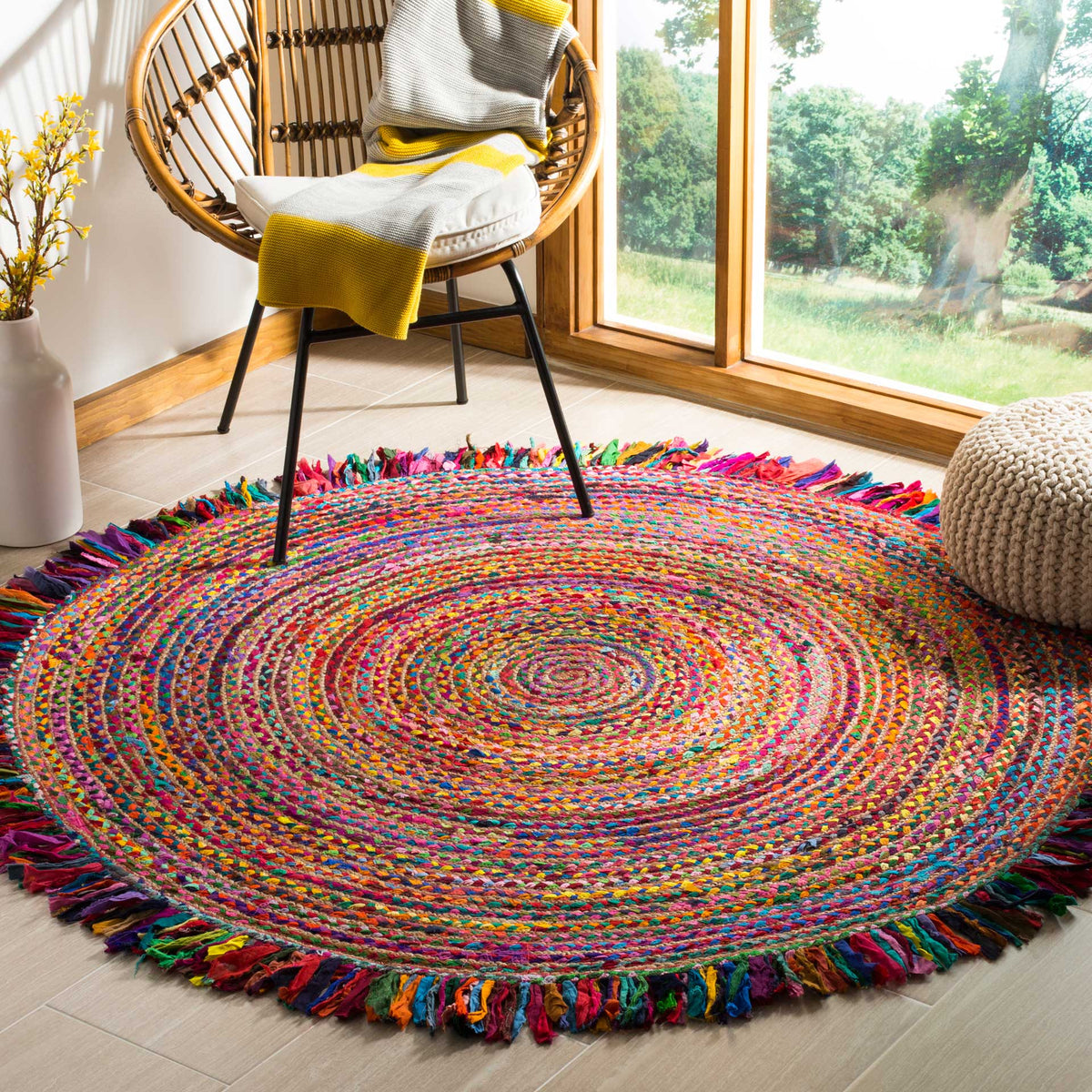 Bright concentric colors and playful fringe energize this round rug.