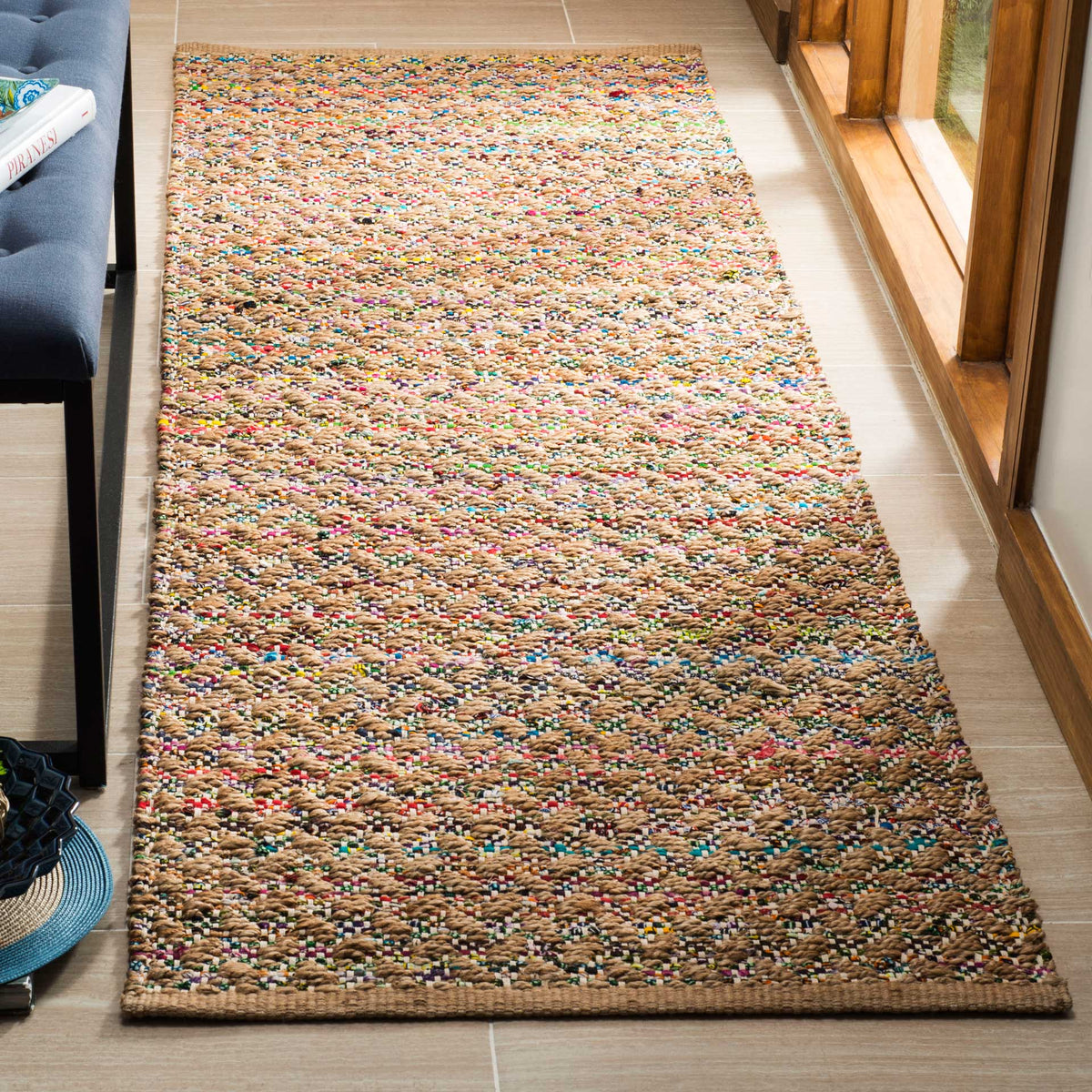Multicolored flecks enliven the warm natural weave of this handwoven runner