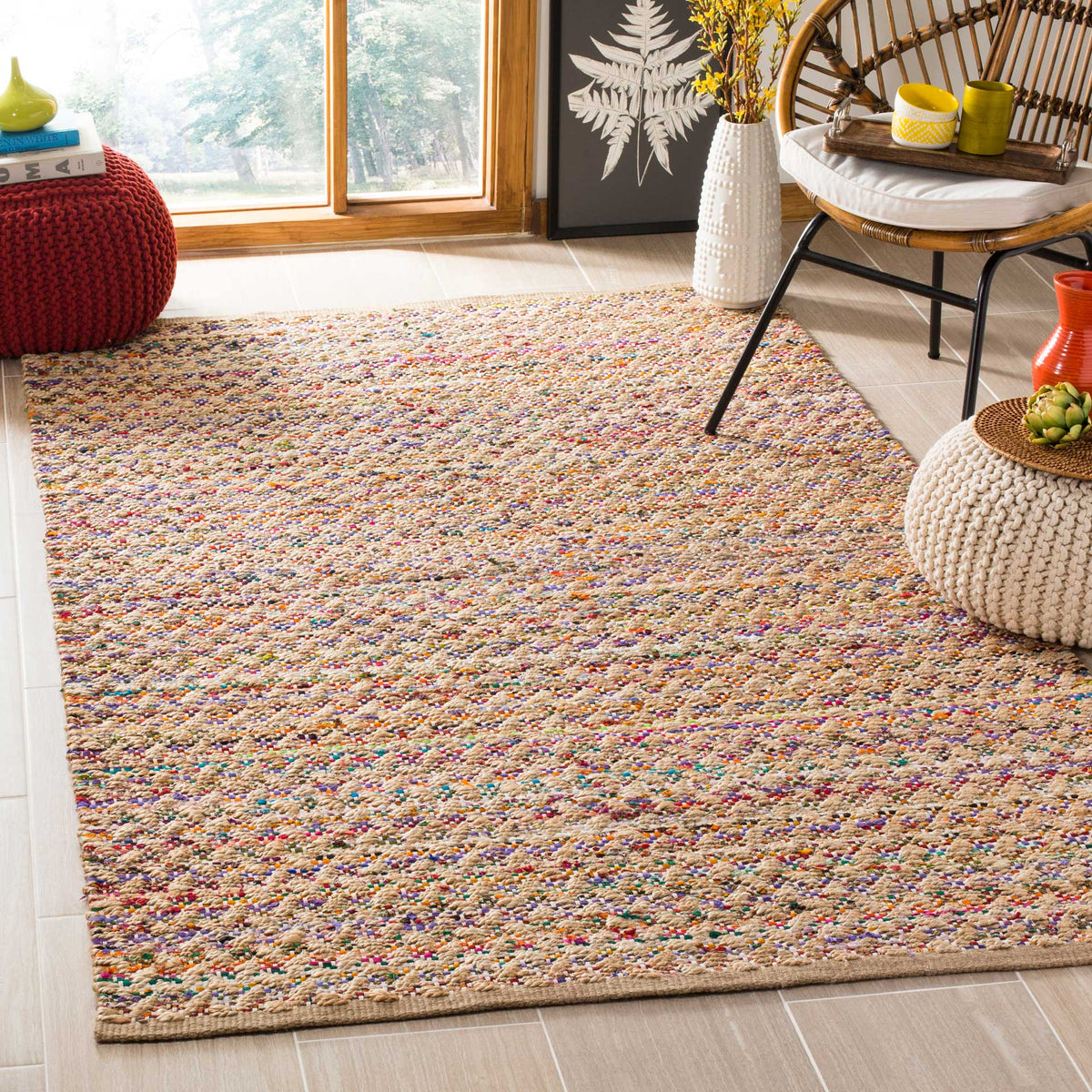 Multicolored flecks give a natural jute rug an inviting, playful finish