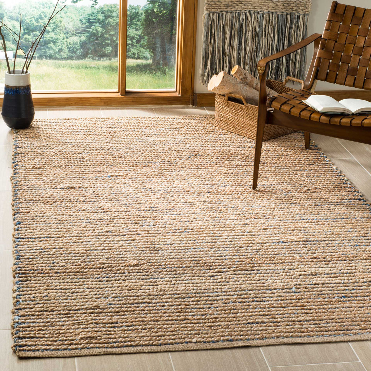 Subtle blue striping adds a cool accent to this warm, natural jute rug