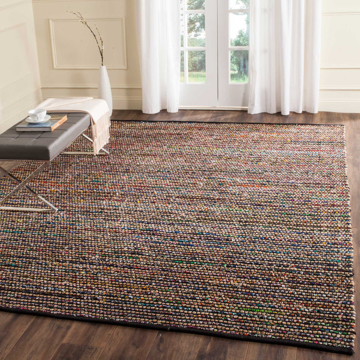 Earthy jute and multicolored rows warm a spacious seating area