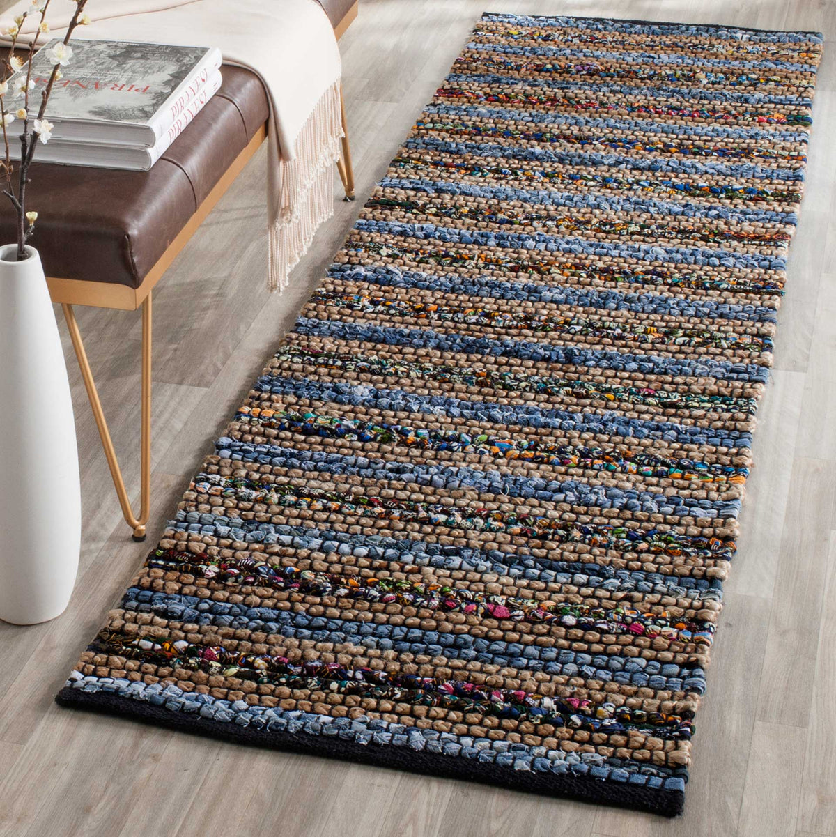 Colorful woven bands and deep blue edging give this runner a bold, inviting feel