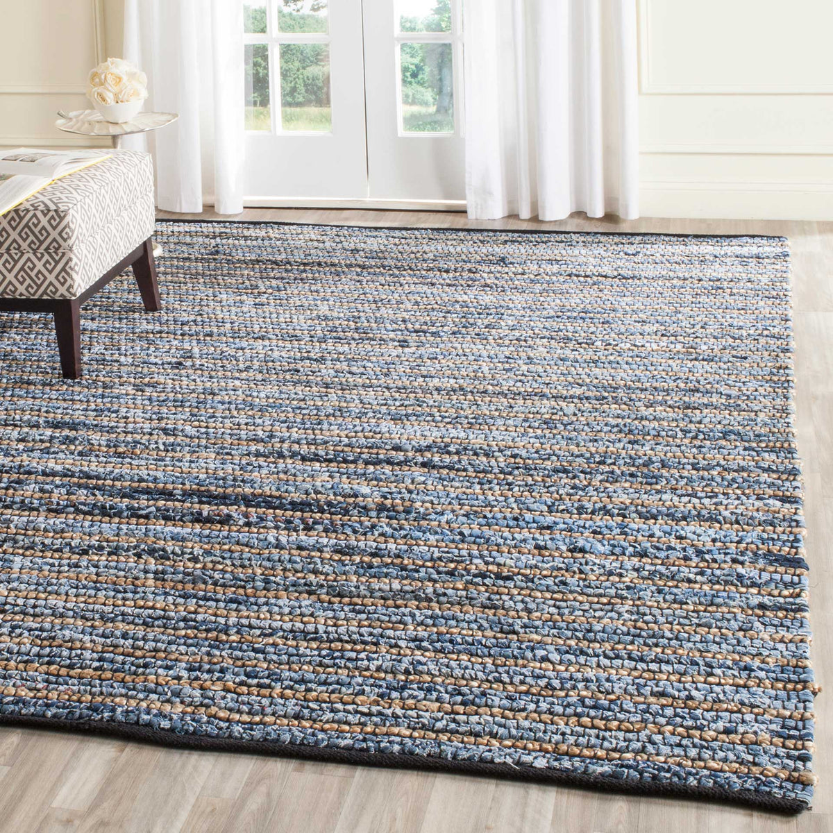 Blue and natural stripes anchor a light-filled room with tactile contrast
