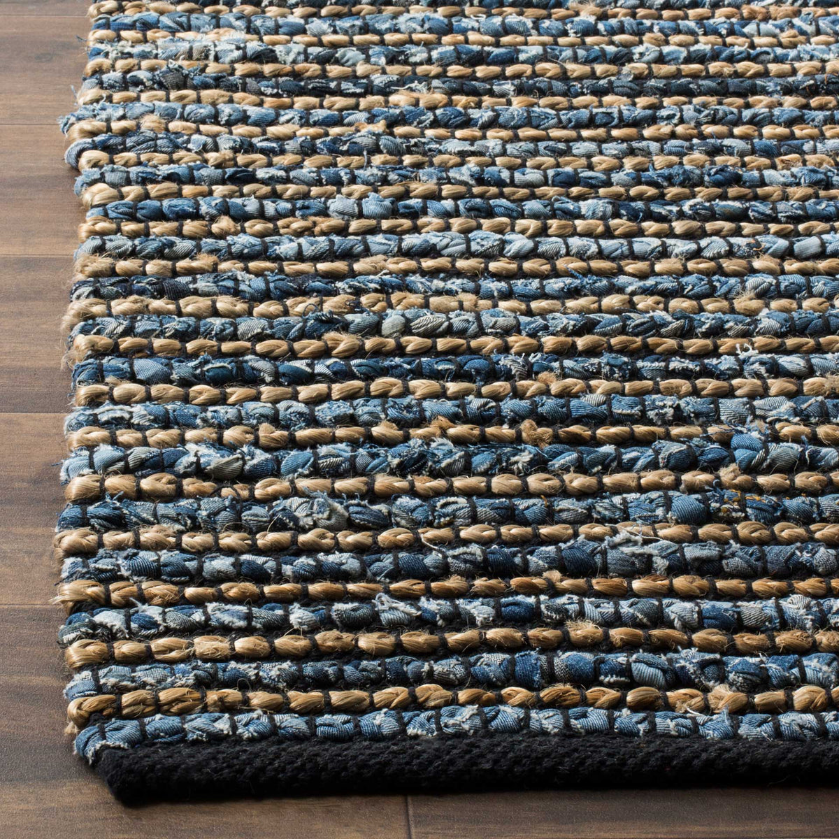 Chunky blue cotton loops and tan jute rows meet at a dark border