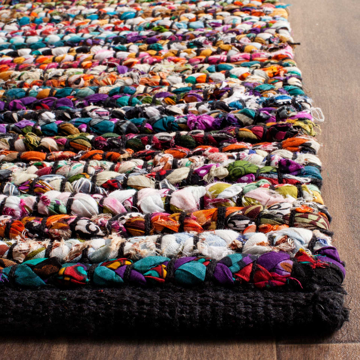 Chunky multicolor fabric knots and dark woven binding add bold texture