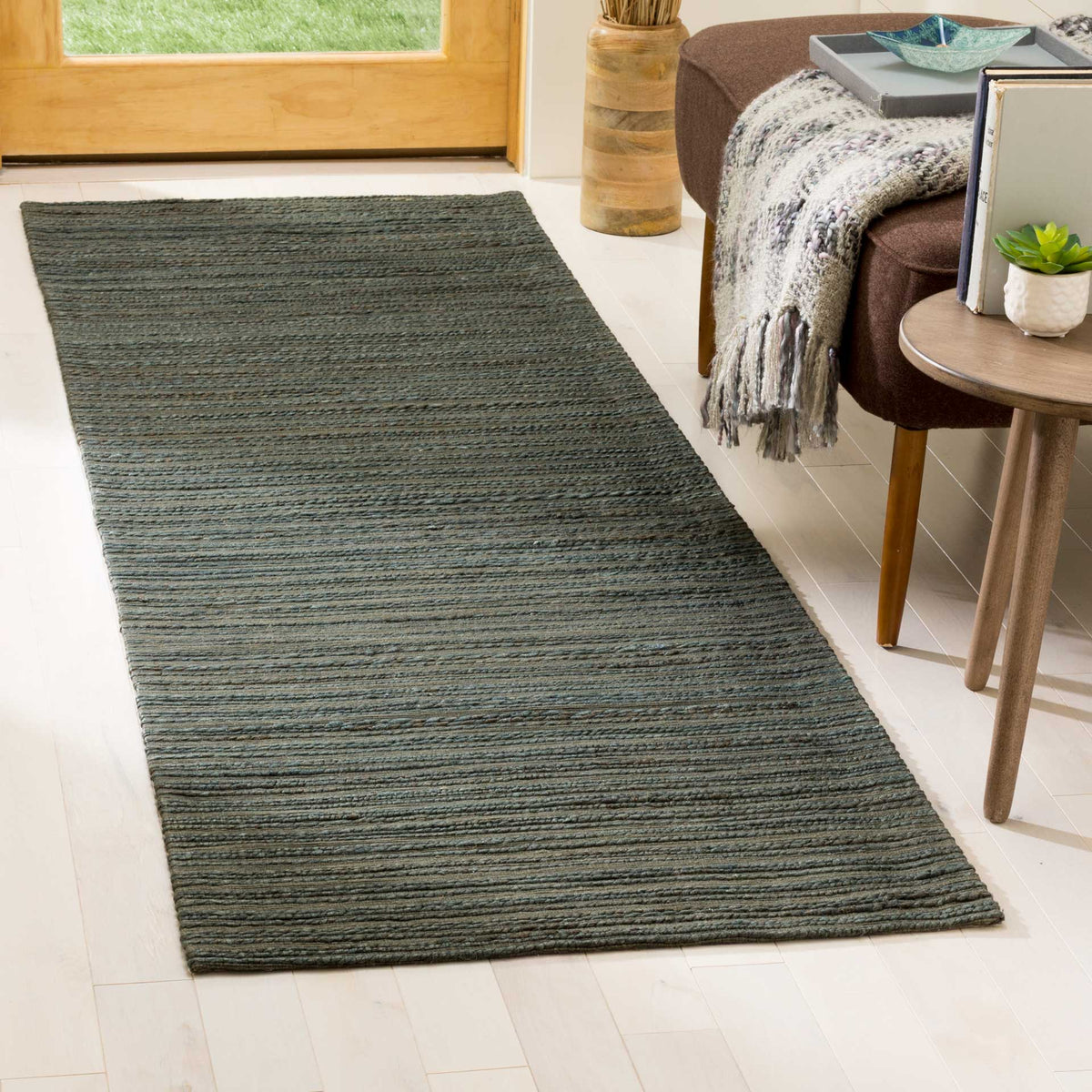 Deep green hemp and cotton fibers bring understated color and texture to this runner