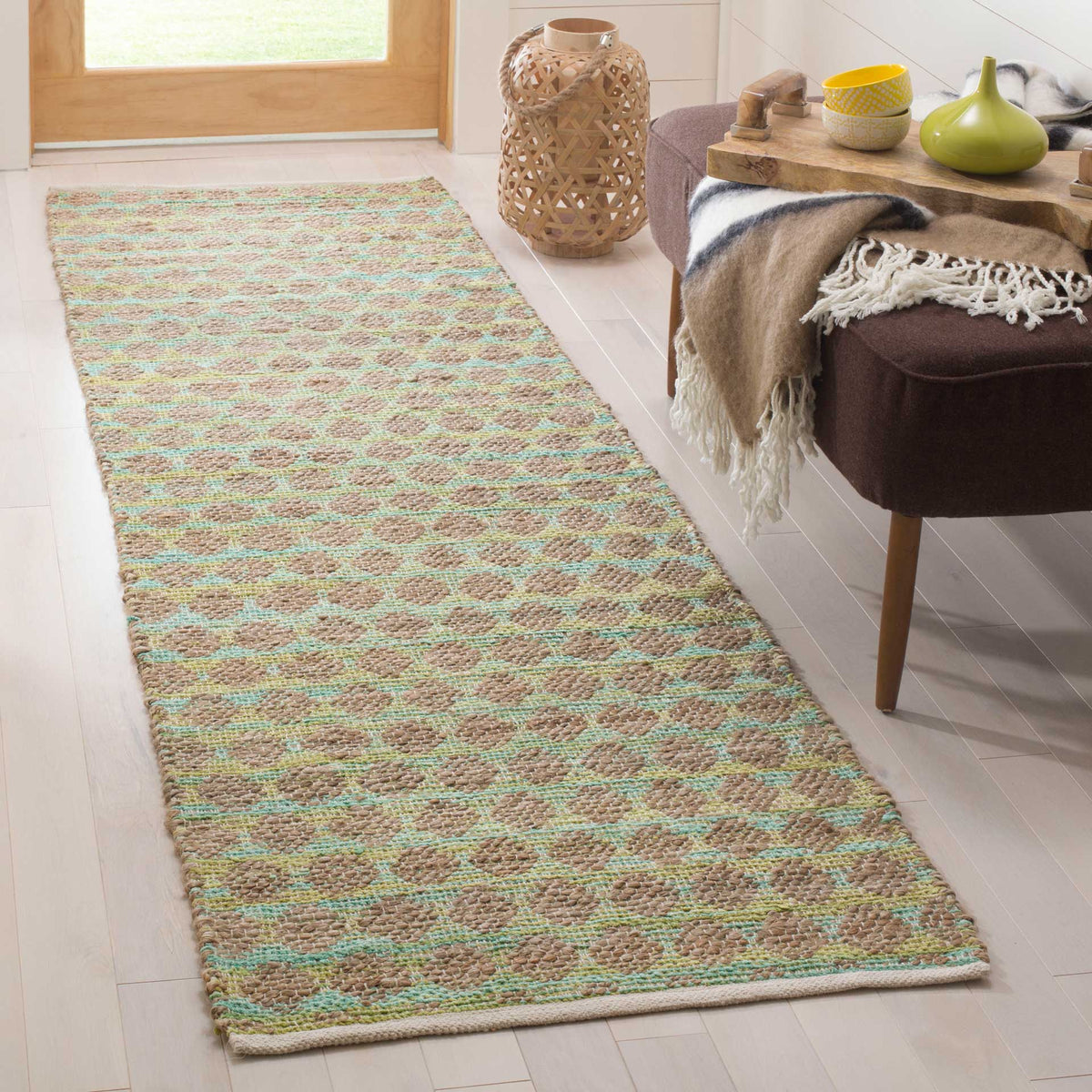 Soft teal shapes bring an airy, patterned look to this natural jute runner