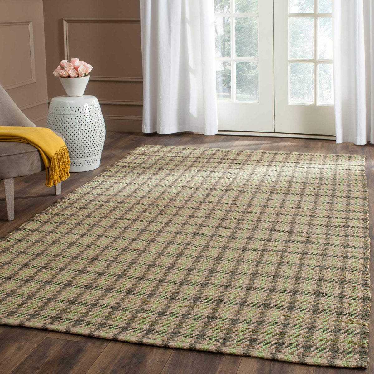 Subtle green checks bring an earthy patterned foundation beneath furniture