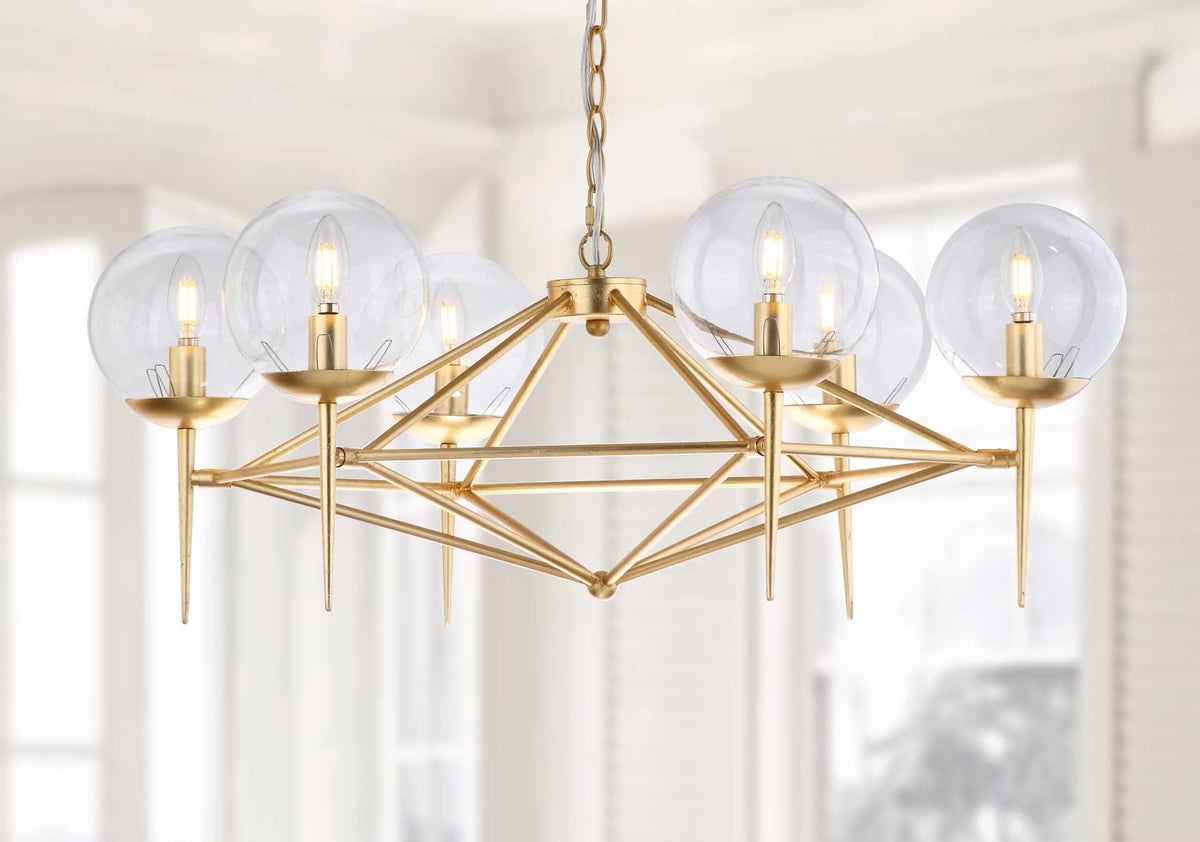 Warm candle-style bulbs illuminate clear glass globes above a sculptural gold leaf frame.