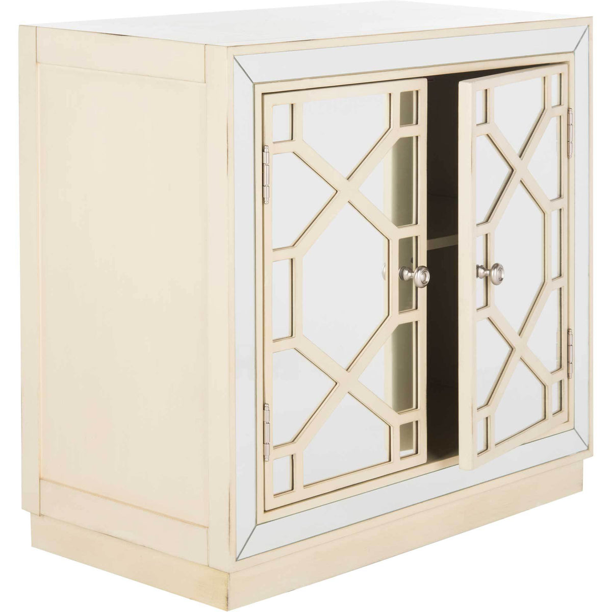 Partially open mirrored doors reveal storage within an antique beige chest with geometric latticework.