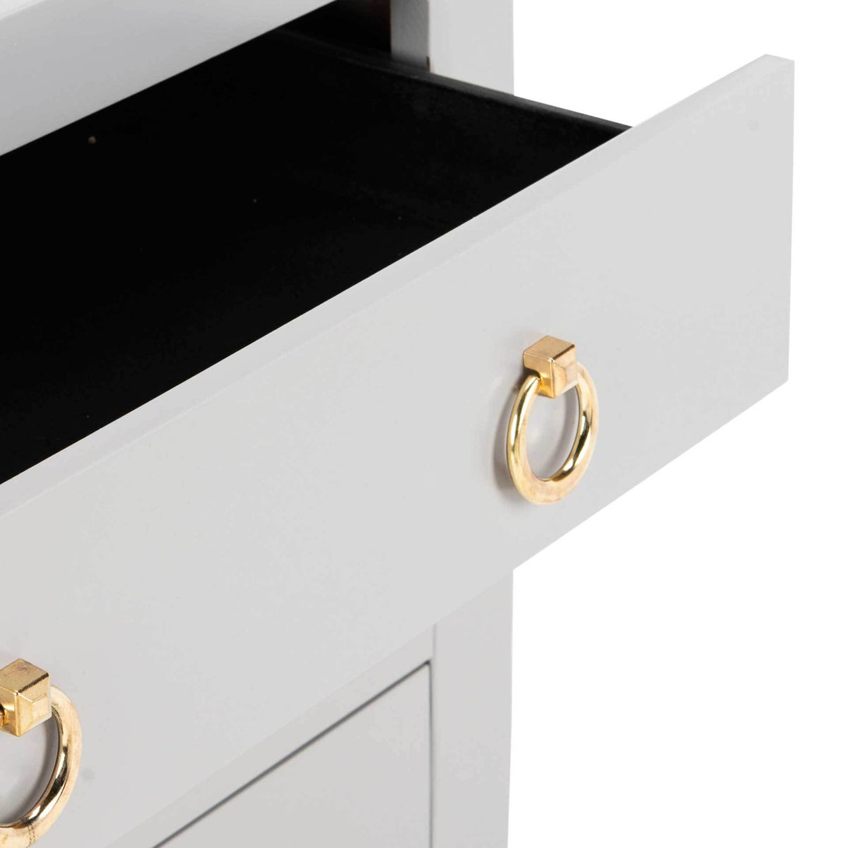 Gray drawer opens to a dark storage space with a polished gold ring pull