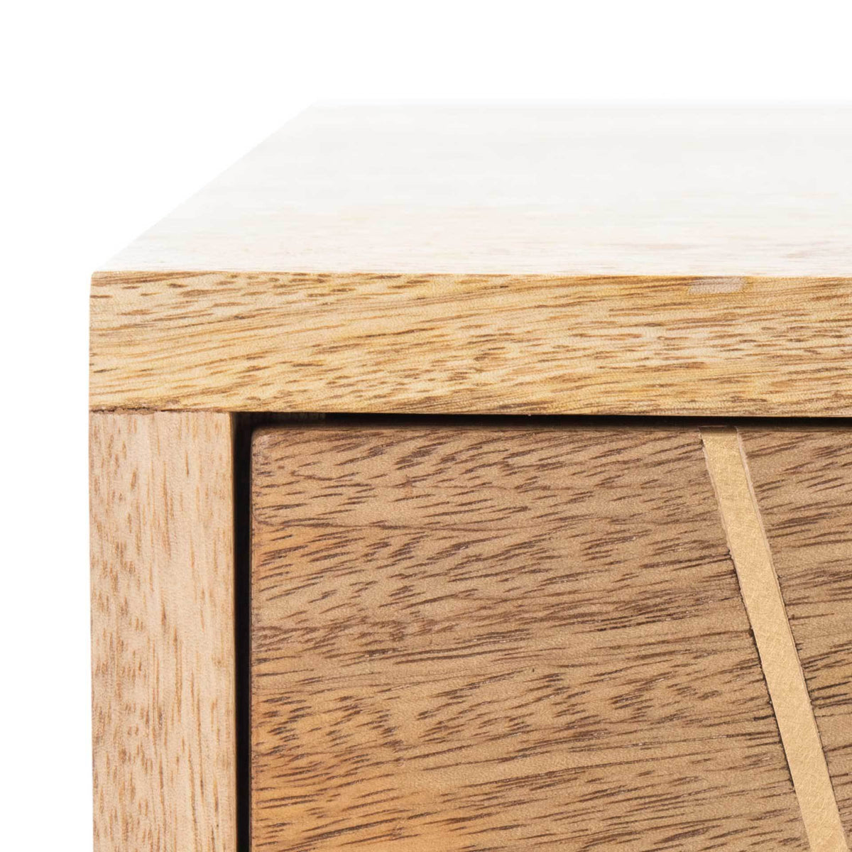 A slim brass inlay crosses richly grained wood beside the chest's clean-lined frame.
