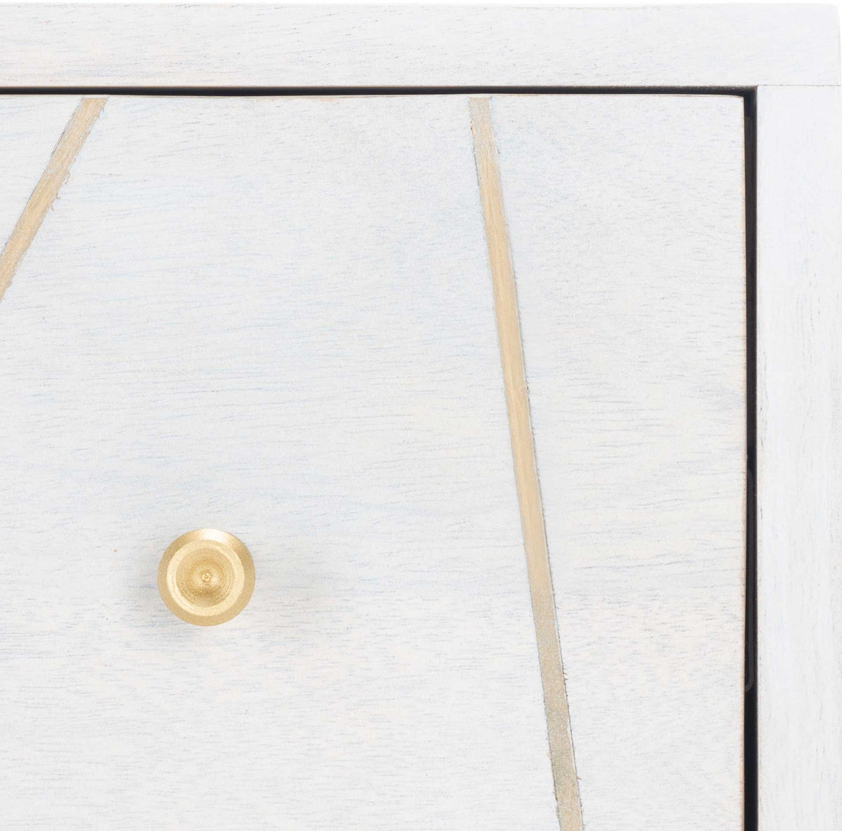 Fine brass inlay and a round brass knob accent the softly textured whitewashed drawer front.