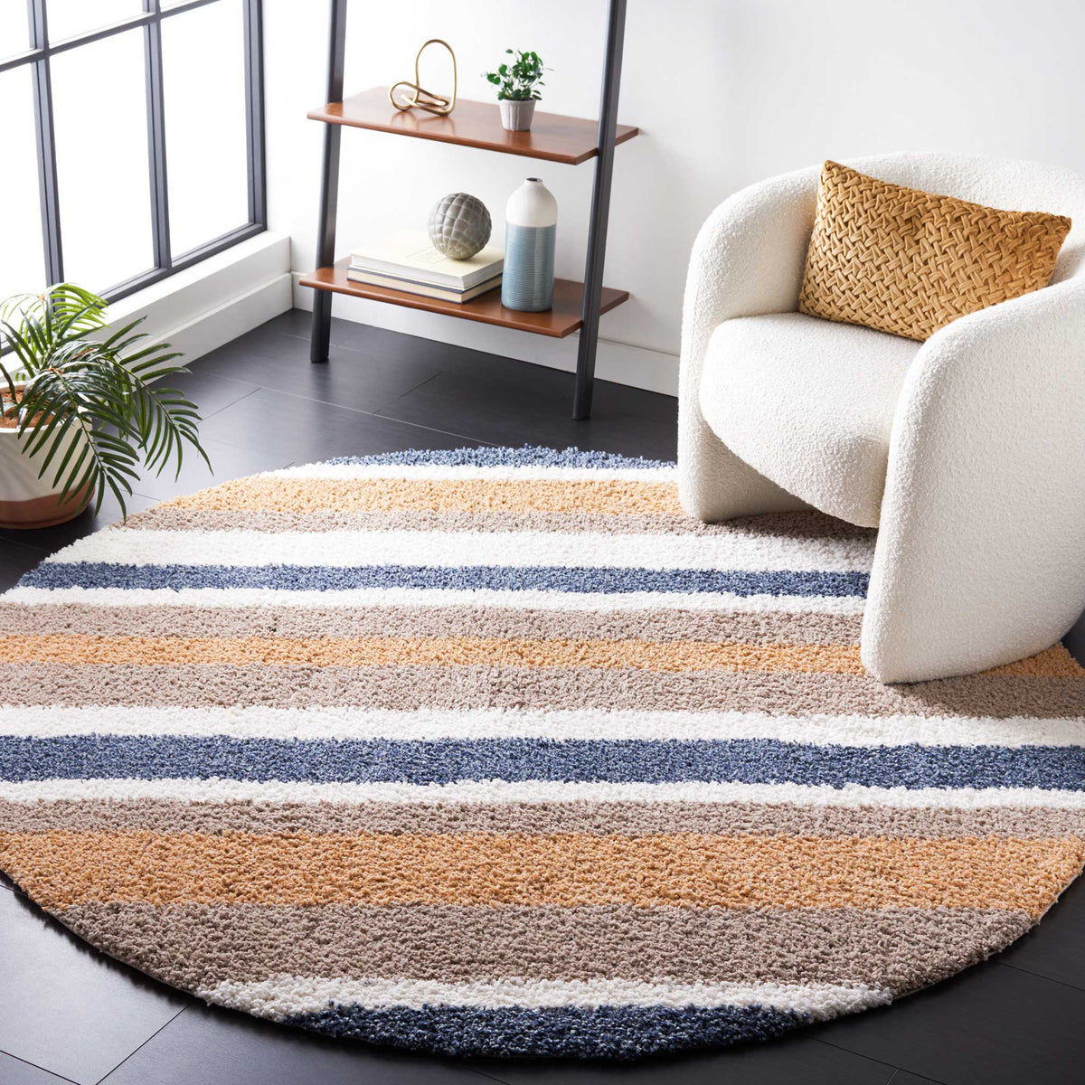 Breezy blue and warm golden stripes add color beneath a cozy chair
