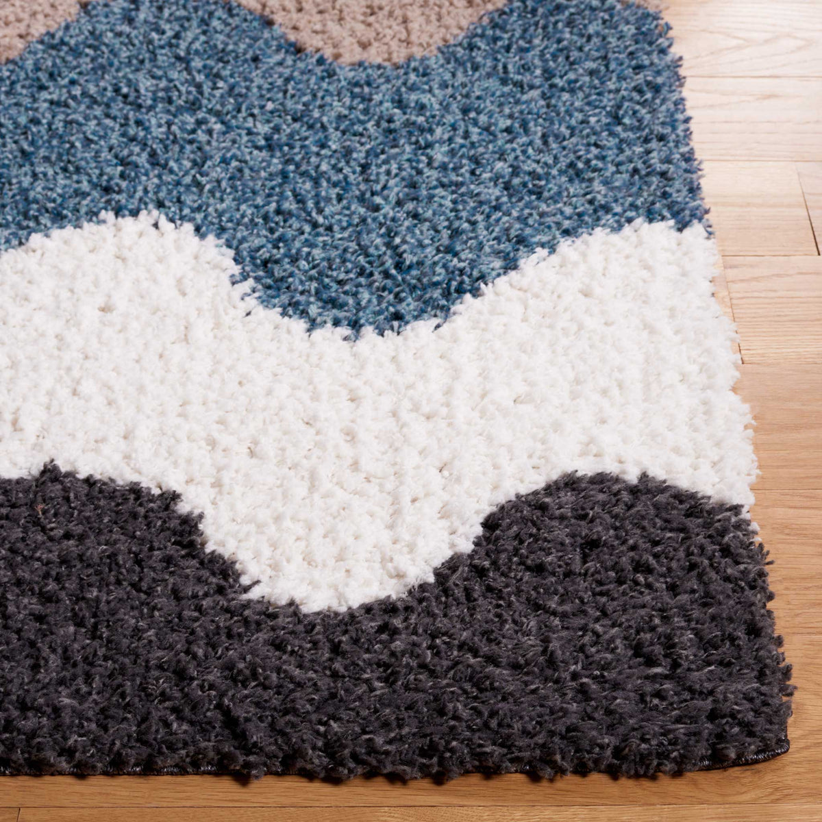 Blue, ivory, and black shag waves flow into a softly finished edge
