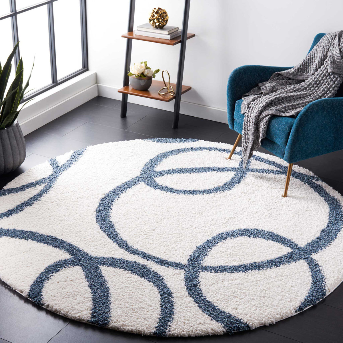 Oversized blue loops create a playful focal point across a soft ivory rug
