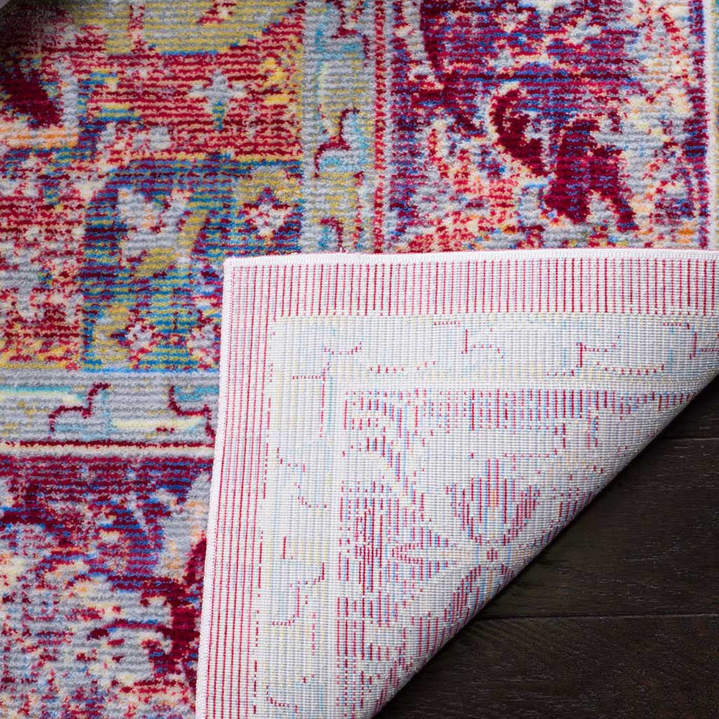 Woven cotton backing supports a richly patterned purple and coral rug