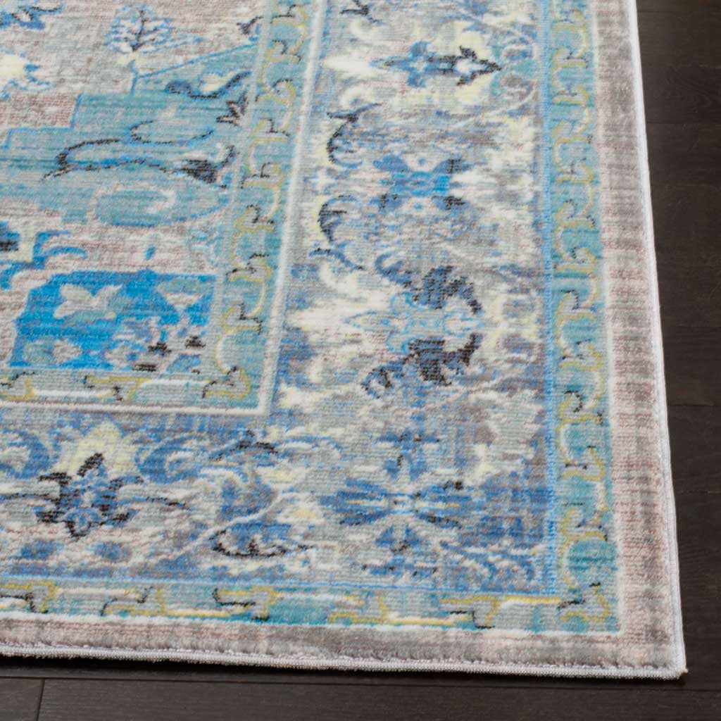 Soft blue and light gray floral motifs meet a neatly finished border on this low-profile rug