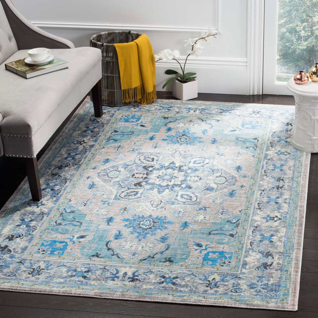 Blue and light gray medallion rug brings a bright, classic pattern to a cozy living space