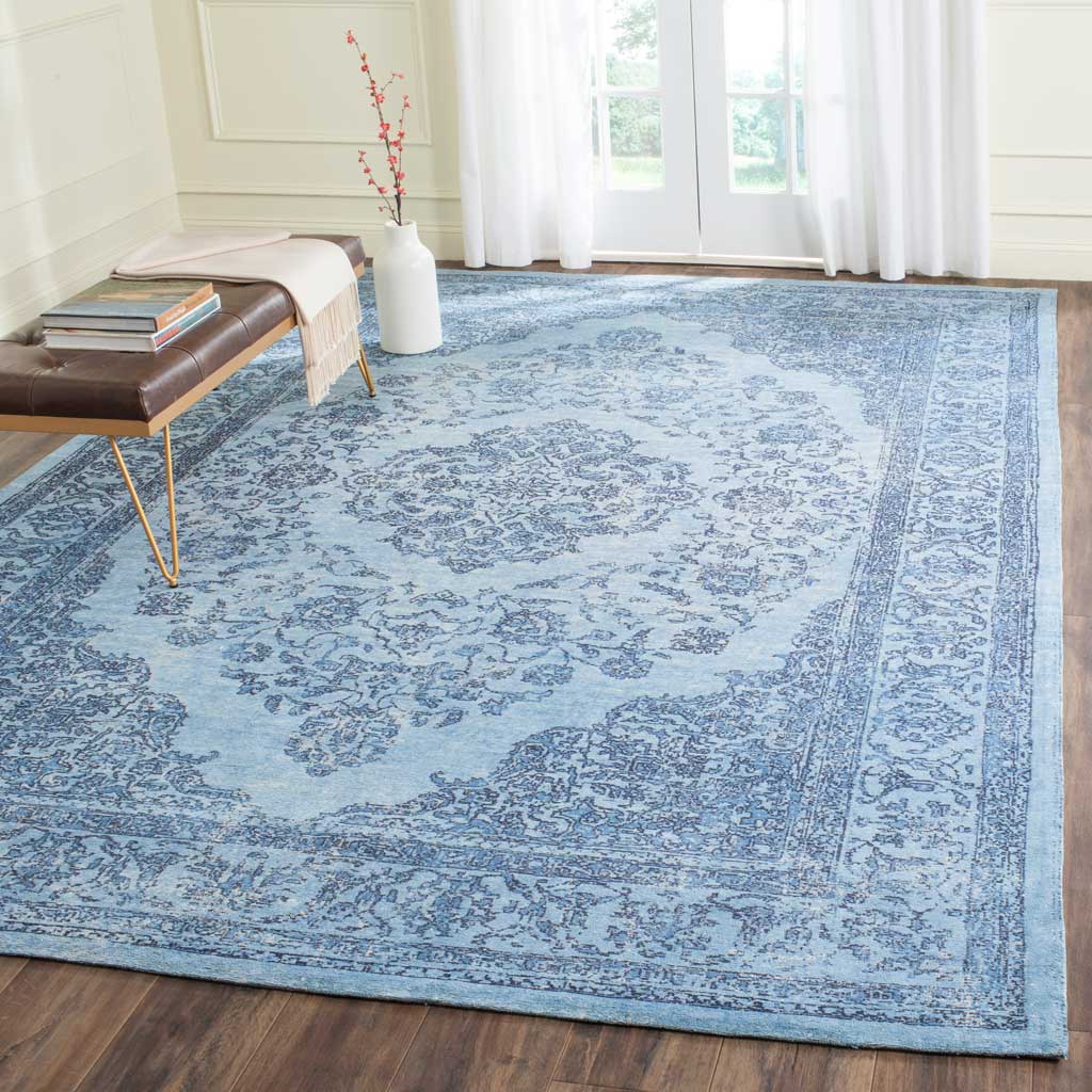 A spacious blue medallion rug brings cool color and vintage elegance to the room.