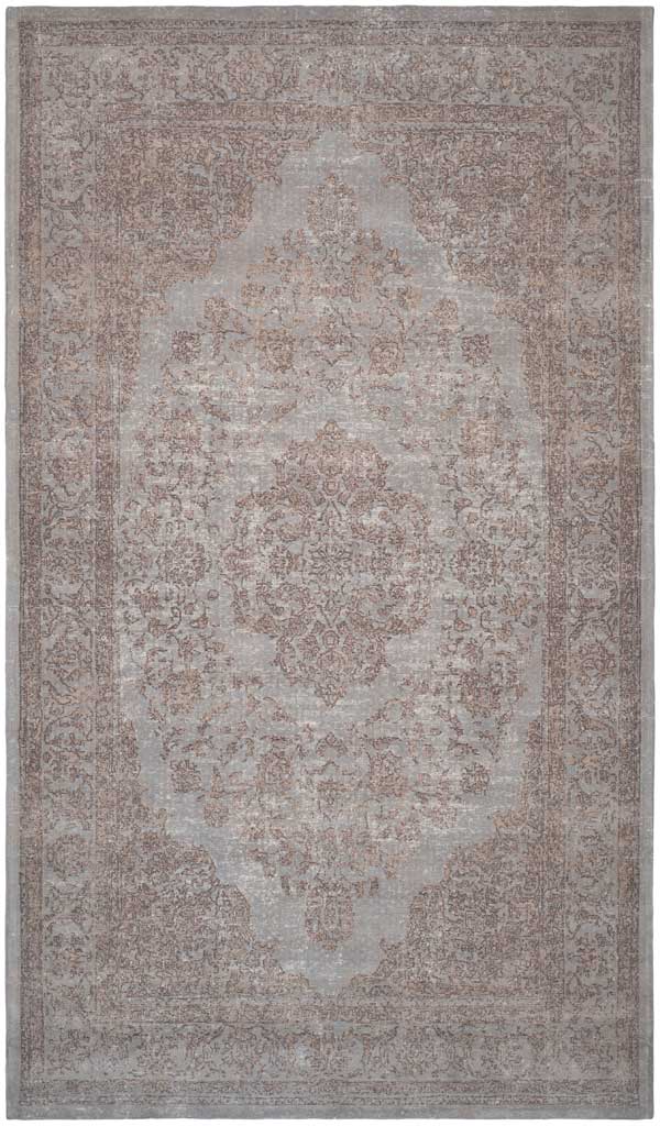 Muted gray and taupe florals surround a weathered central medallion on this rug.