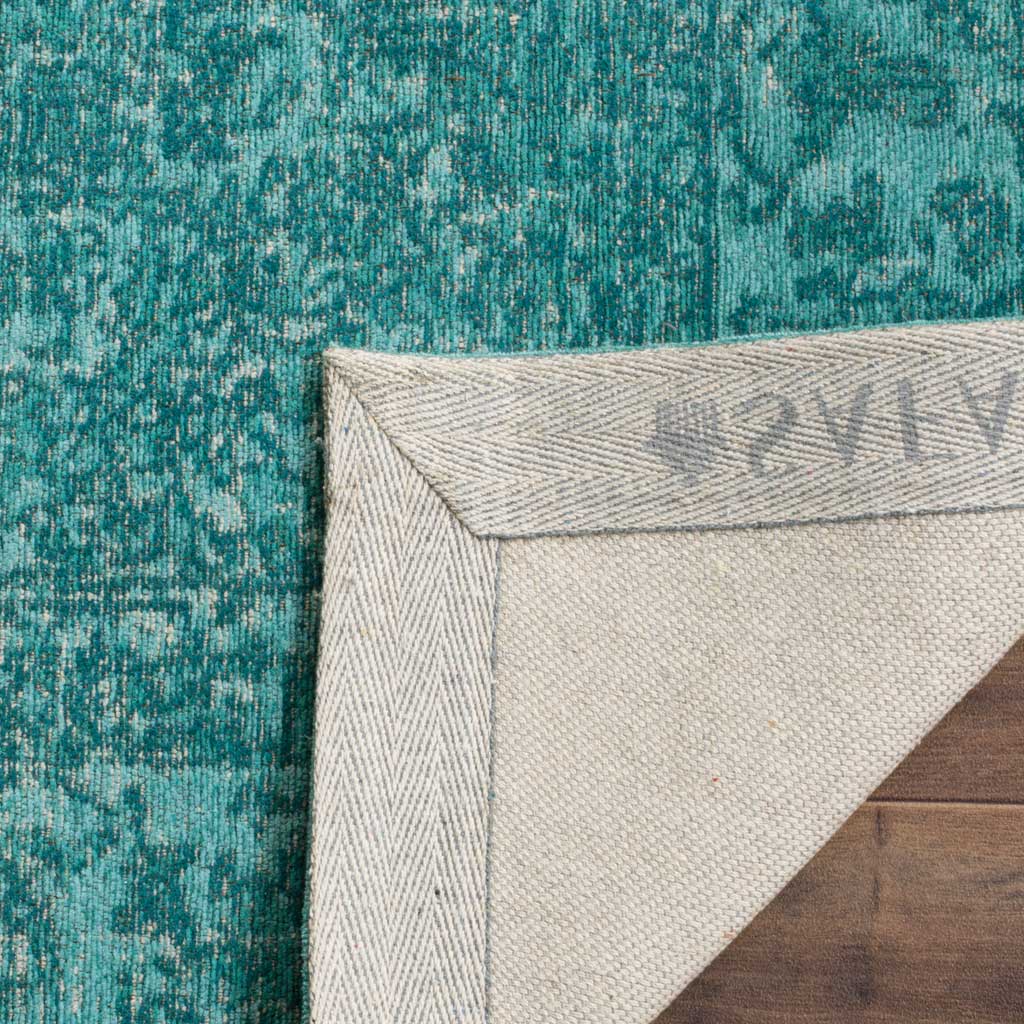 A light woven backing and reinforced edge support the vibrant aqua patterned surface.