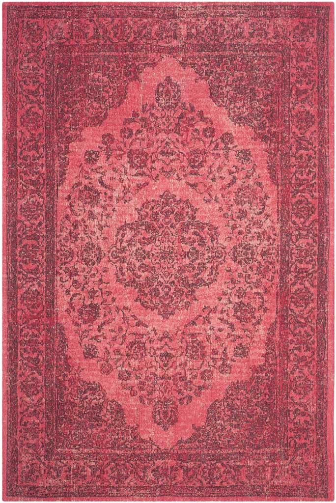A bold fuchsia field and shadowed ornamentation bring depth to this classic medallion rug.