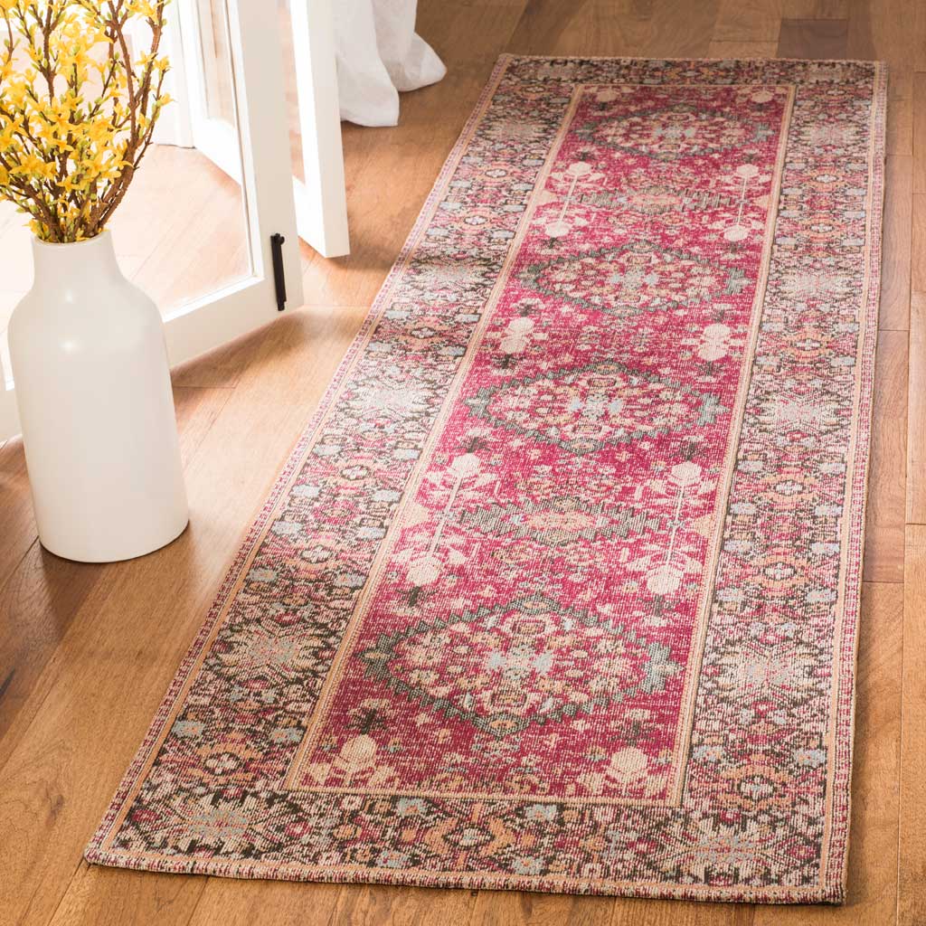 Rich red runner rug blends floral medallions with a wide, intricately patterned multicolor border.