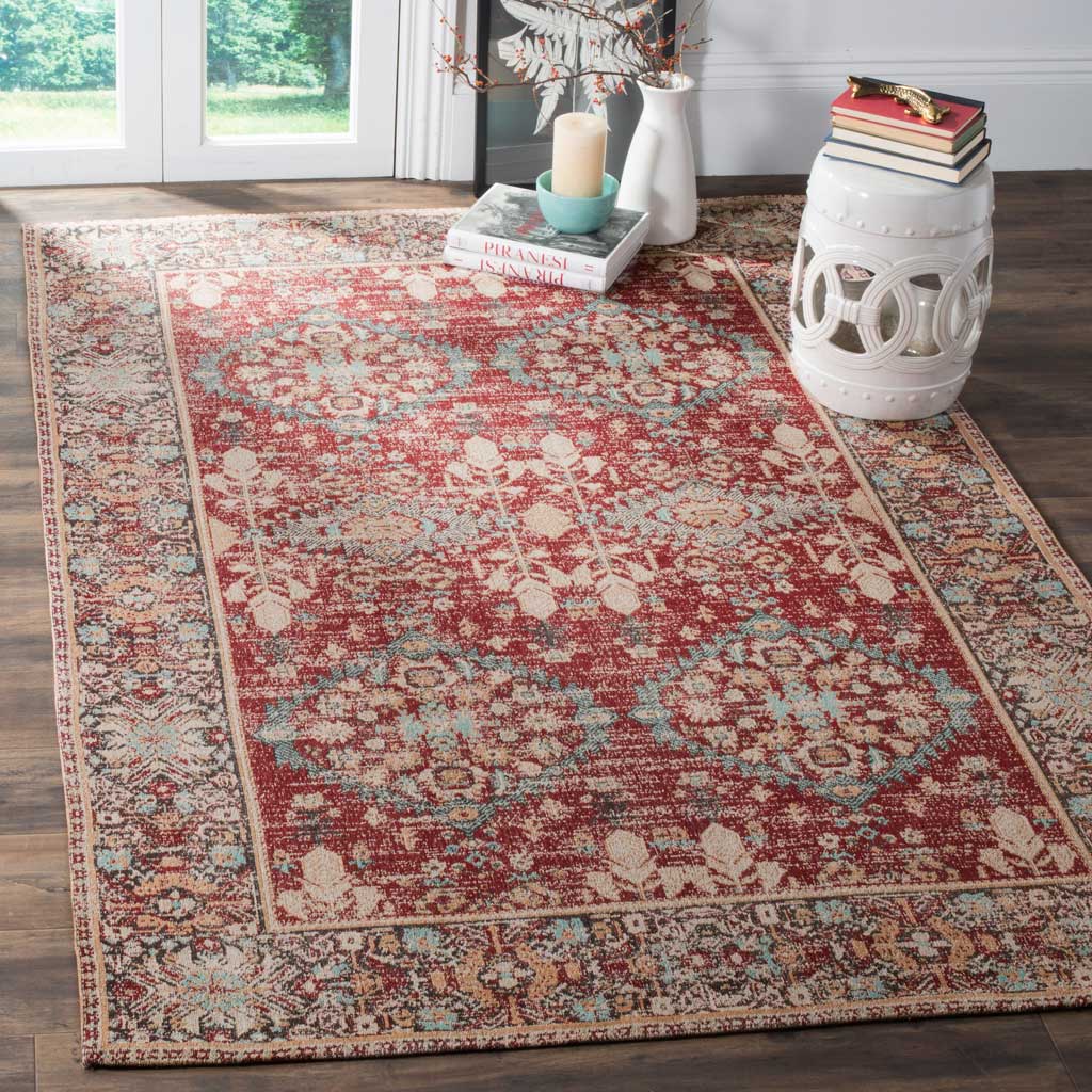 Rich red and pale aqua florals lend vintage character to a warmly furnished room.