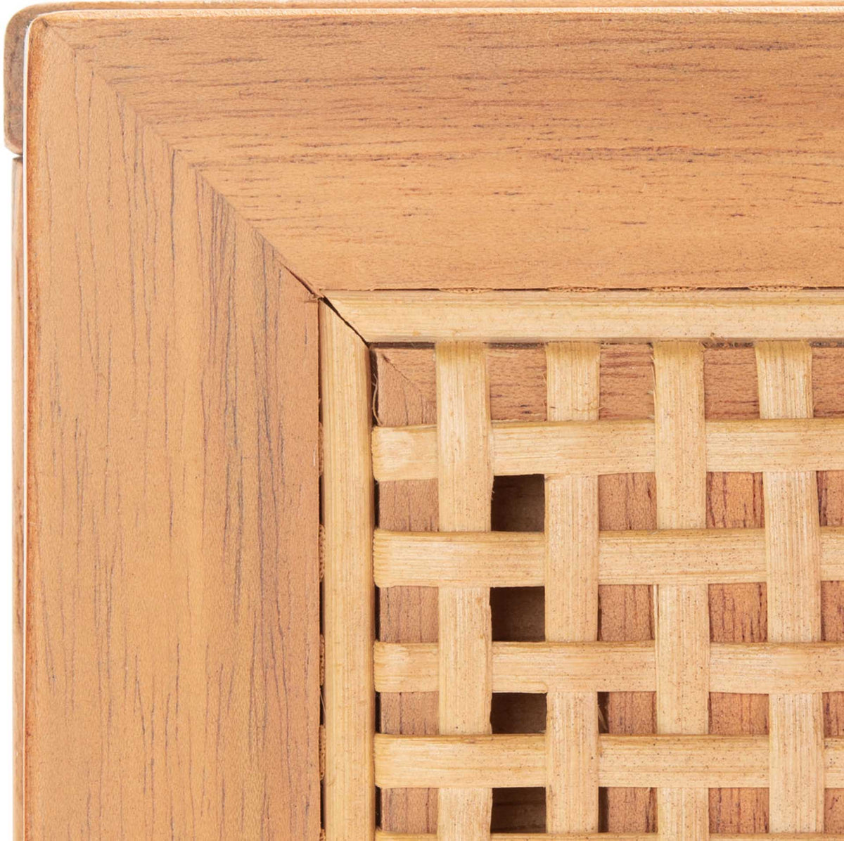 Intricate rattan webbing sits within a natural wood drawer frame for rich woven texture.