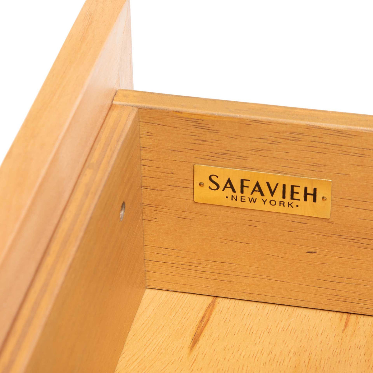 Smooth wood grain and fitted panels bring warmth to the drawer interior.