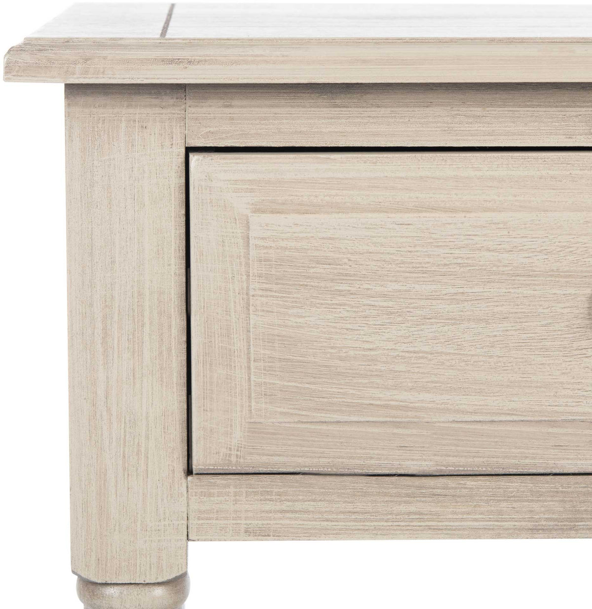 A softly distressed greige finish accentuates the inset drawer panel and broad tabletop edge.