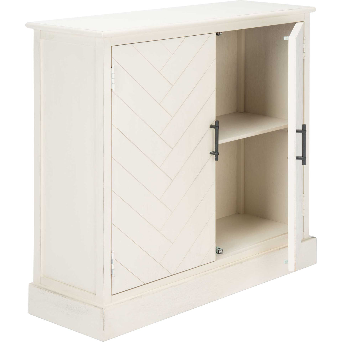 An open door reveals a fixed shelf and two storage spaces inside this distressed white sideboard.