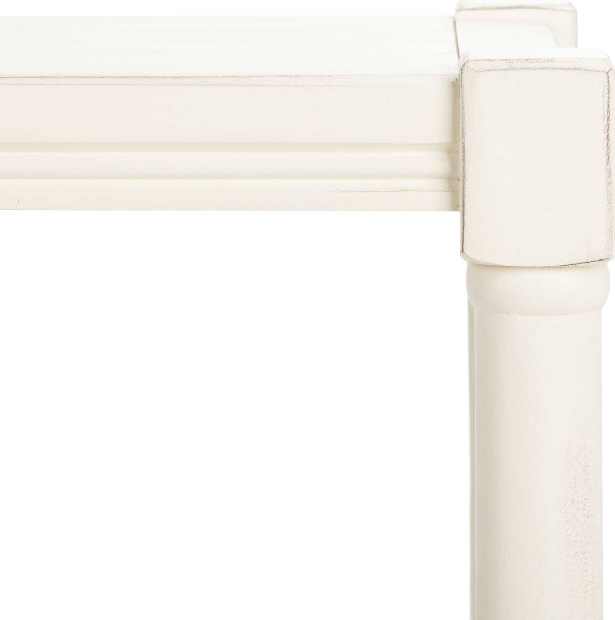 A square corner cap and subtle distressing add texture to the white console's turned post.