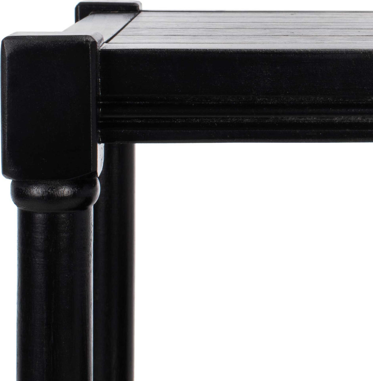 A grooved tabletop edge meets a square corner post above a gently turned black leg.