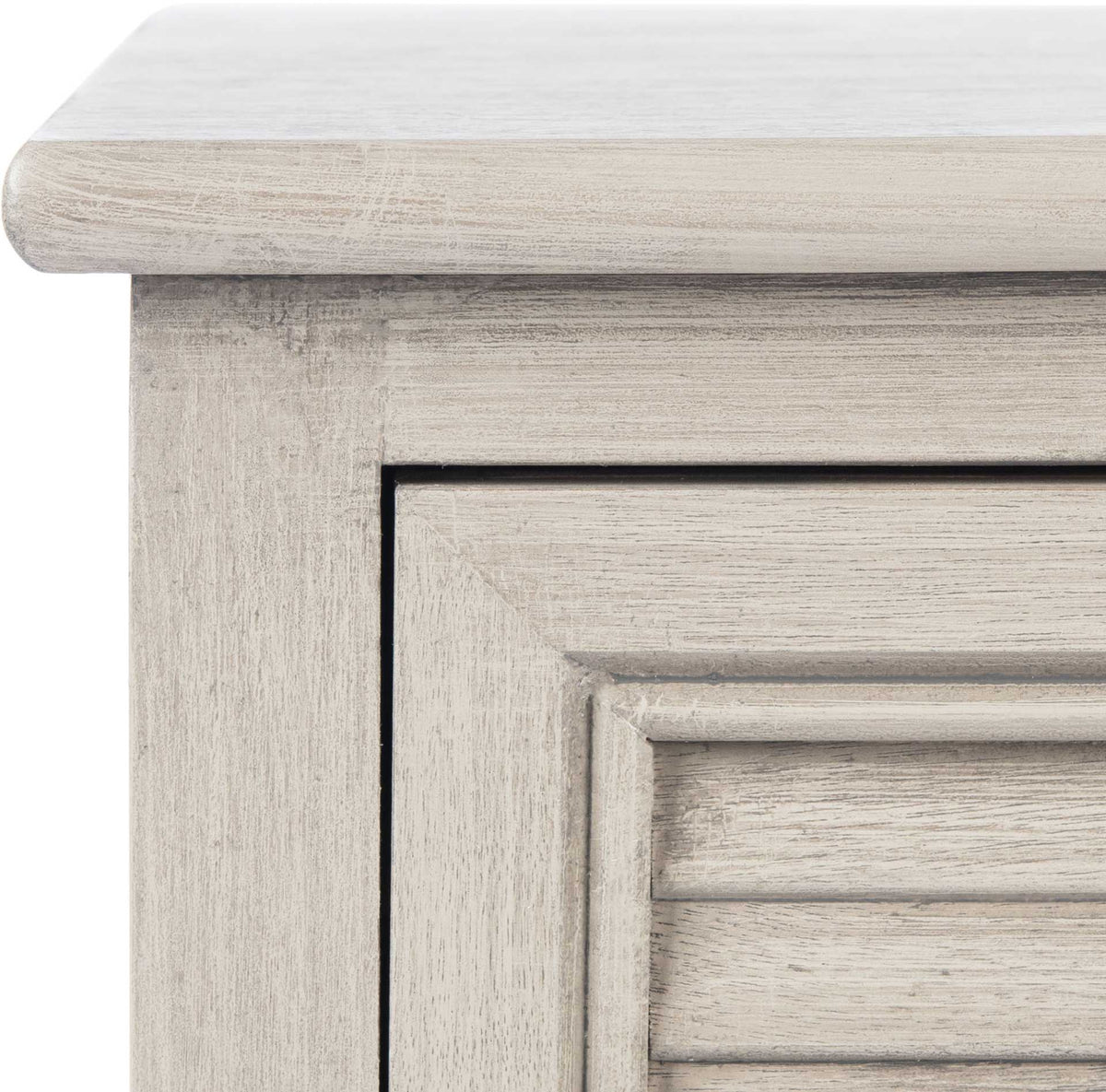 Rounded top edges and lightly distressed wood grain add texture to the greige sideboard.