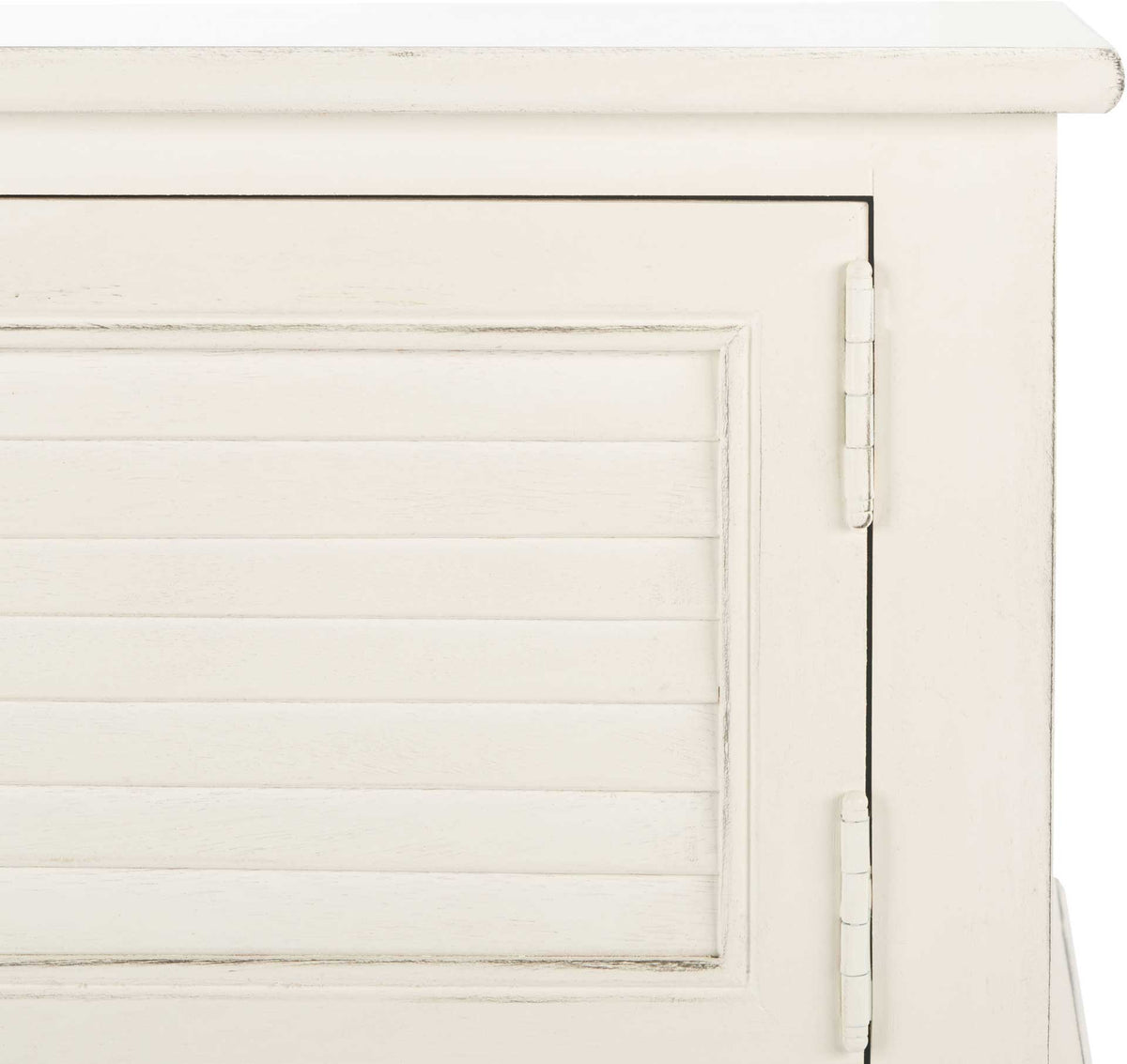 Fine rubbed edges define the white slatted cabinet door and its painted metal hinges.