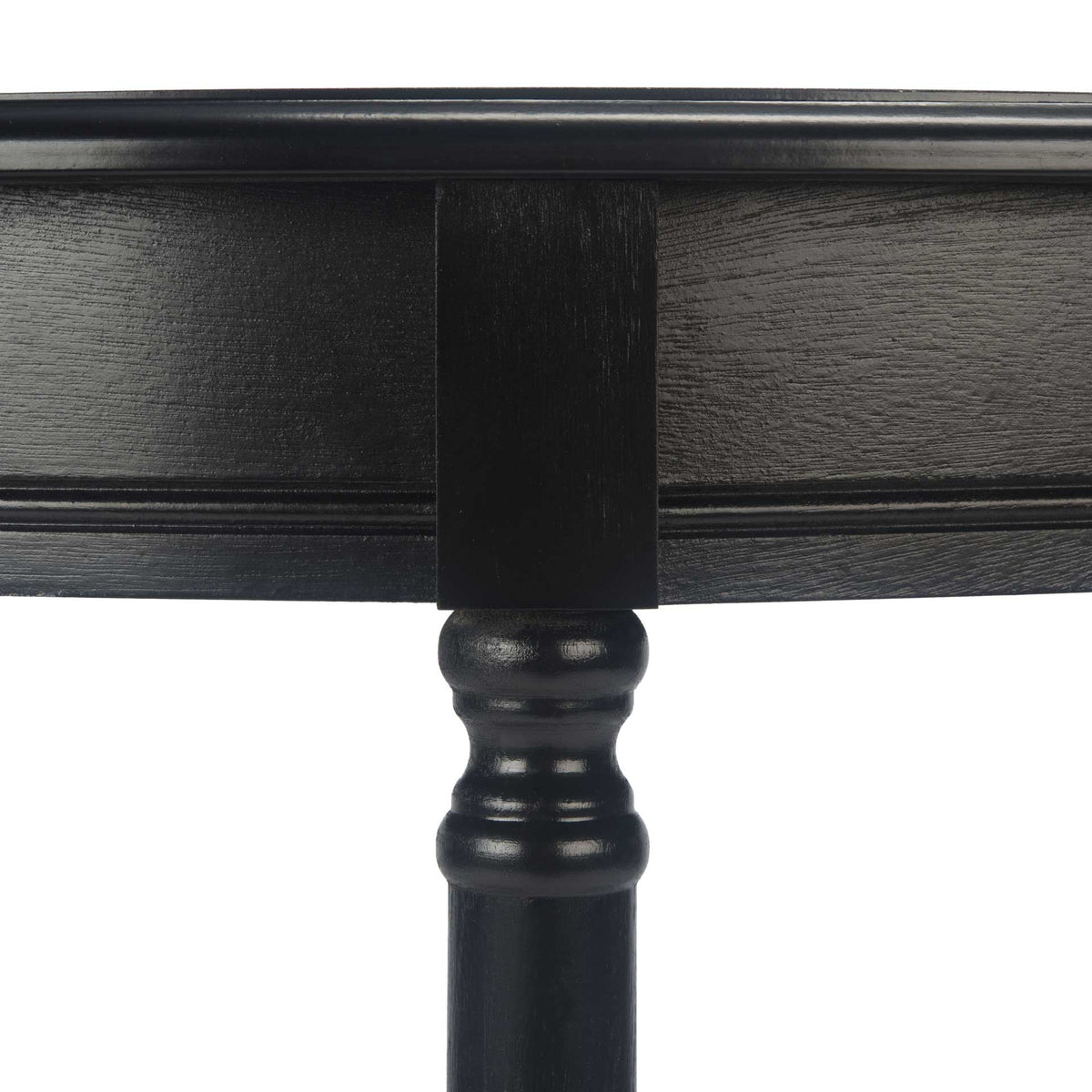 The turned black leg brings a traditional accent to the curved console apron.
