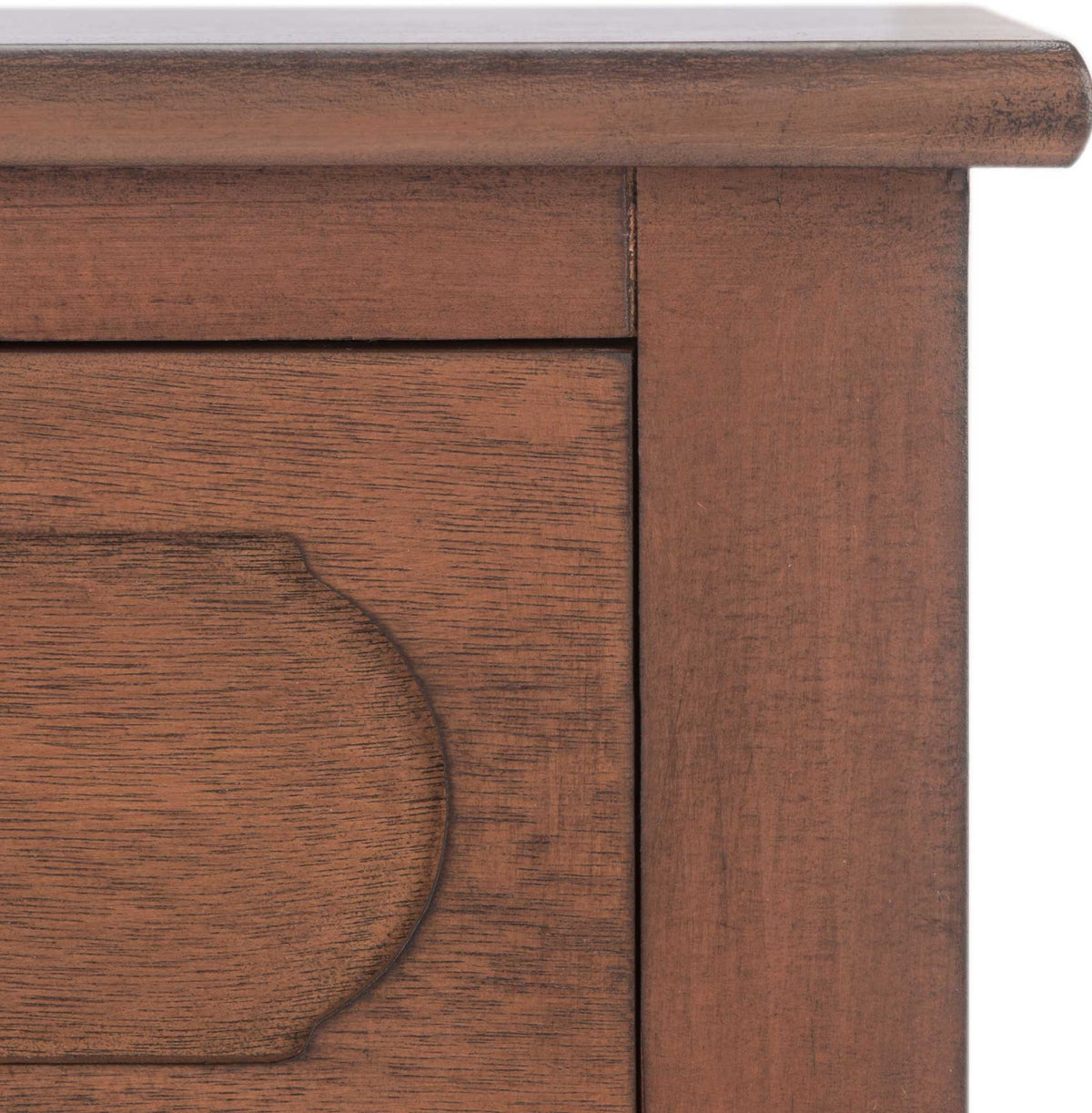 Warm brown wood grain, a molded top edge, and curved drawer detailing add traditional charm.