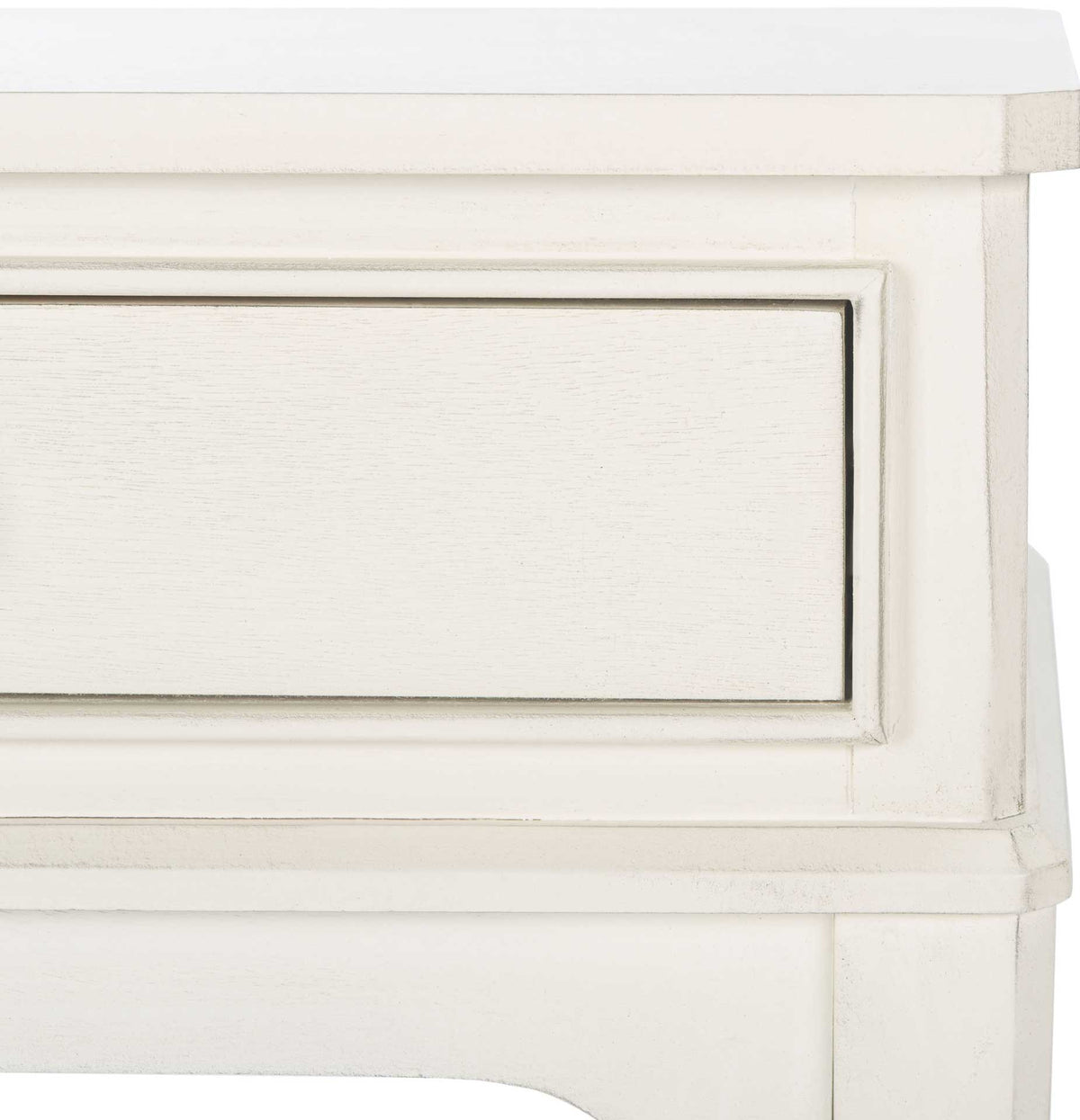 A lightly distressed white finish highlights framed drawer trim and soft apron curves
