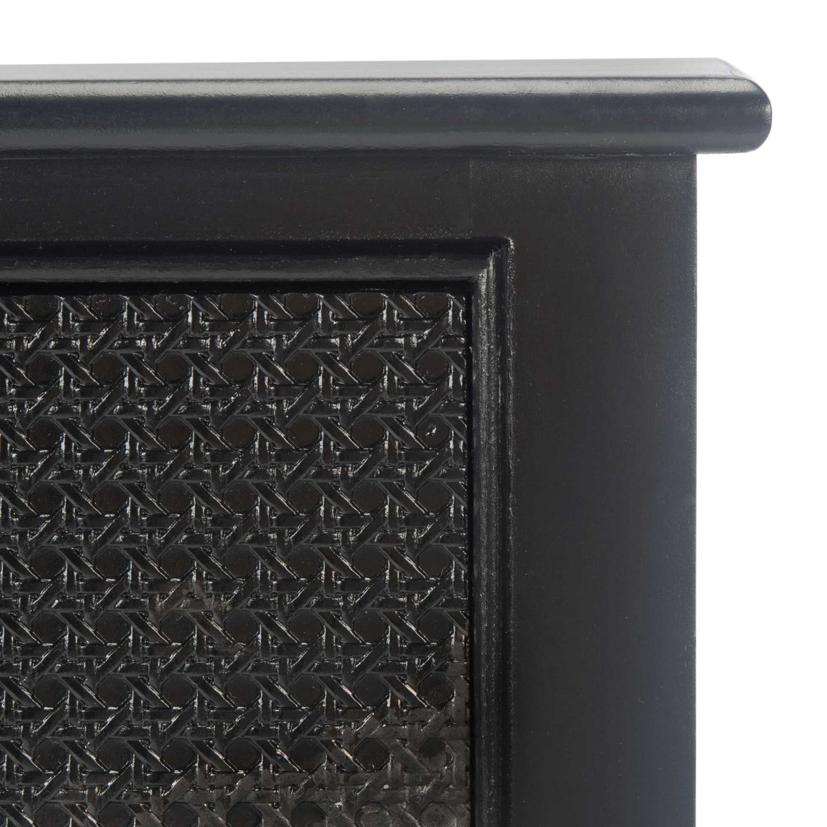A framed geometric drawer inset adds texture beneath the smooth black tabletop