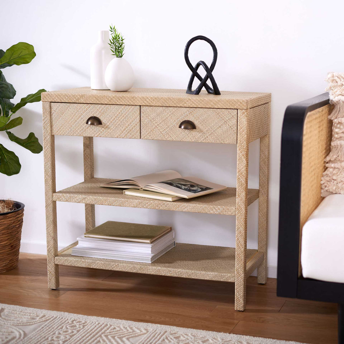 Natural woven console brings two drawers and open shelves to a bright living space