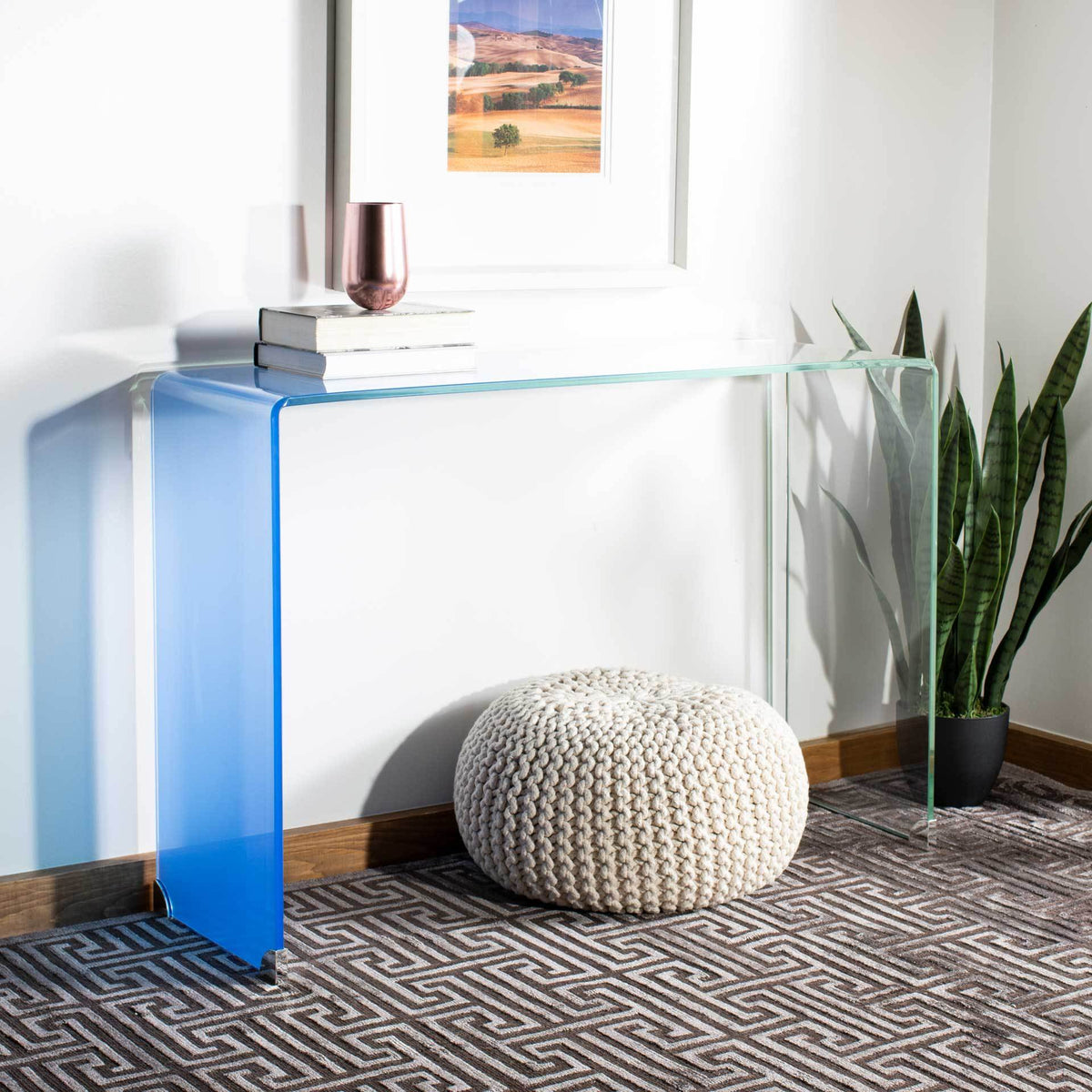 Blue ombre glass console pairs bold color with a light, open profile