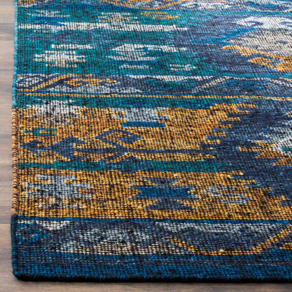 Dense blue and gold weaving highlights the rug's patterned border and neatly finished edges.