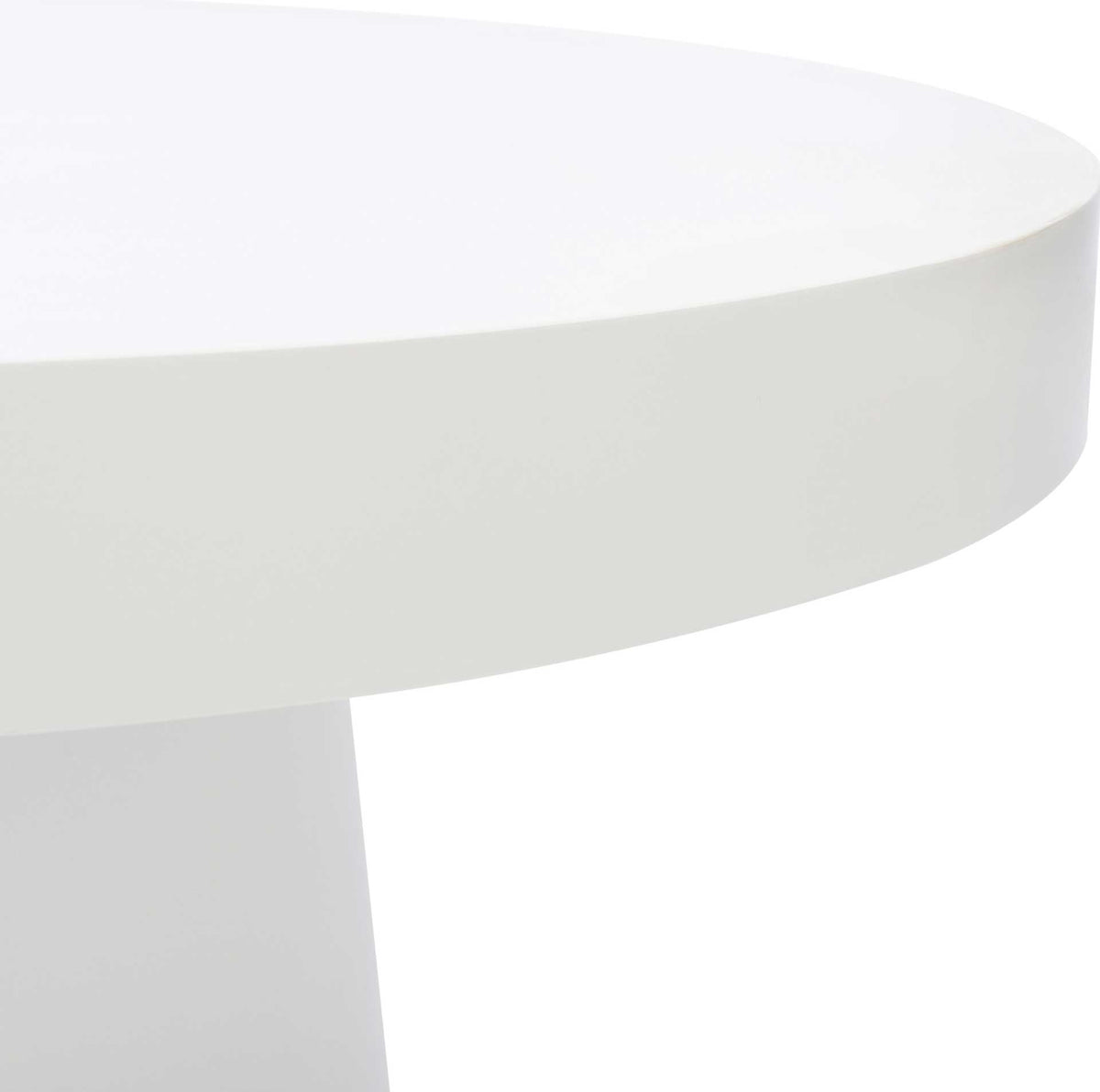 A thick, rounded tabletop edge adds sculptural depth to the smooth white finish.