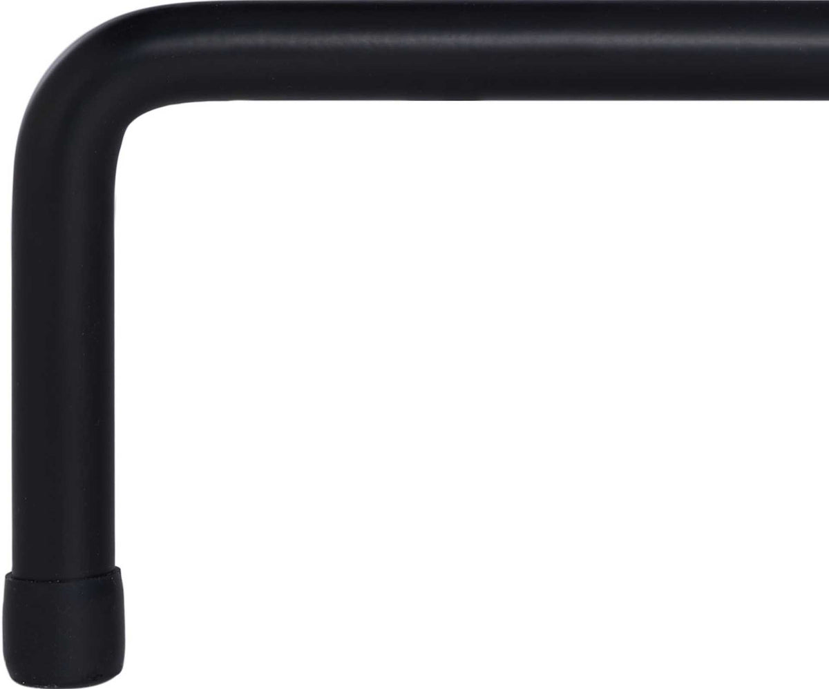 A smooth black iron leg bends into a capped foot for a polished, grounded finish.